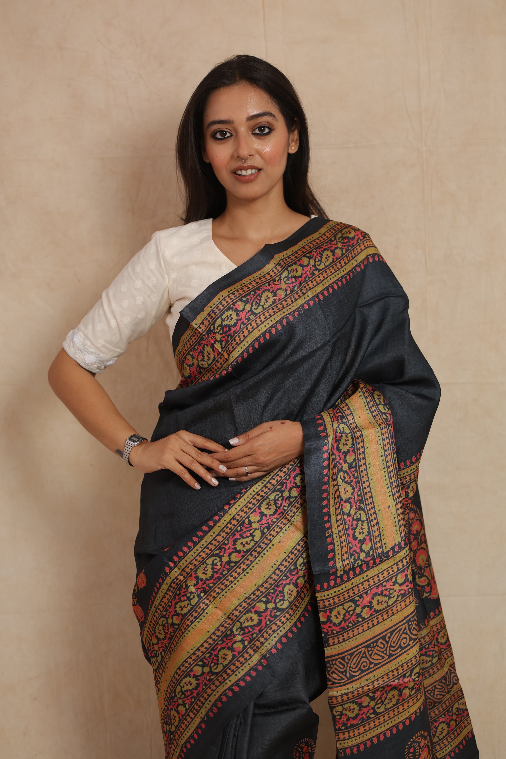 Portrait view of model wearing elegant midnight zed black Batik Tussar silk saree