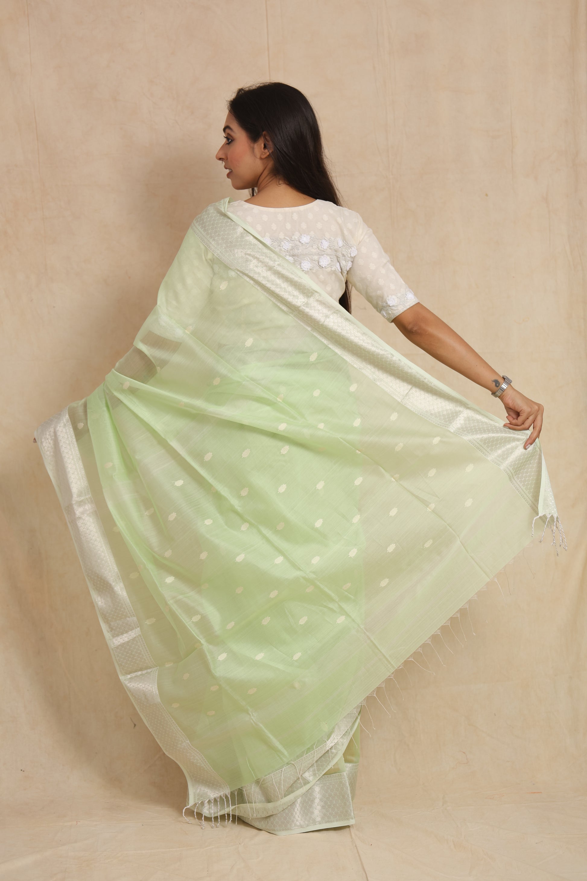 Back view showcasing the woven pallu and border of pastel mint green Maheshwari SICO saree