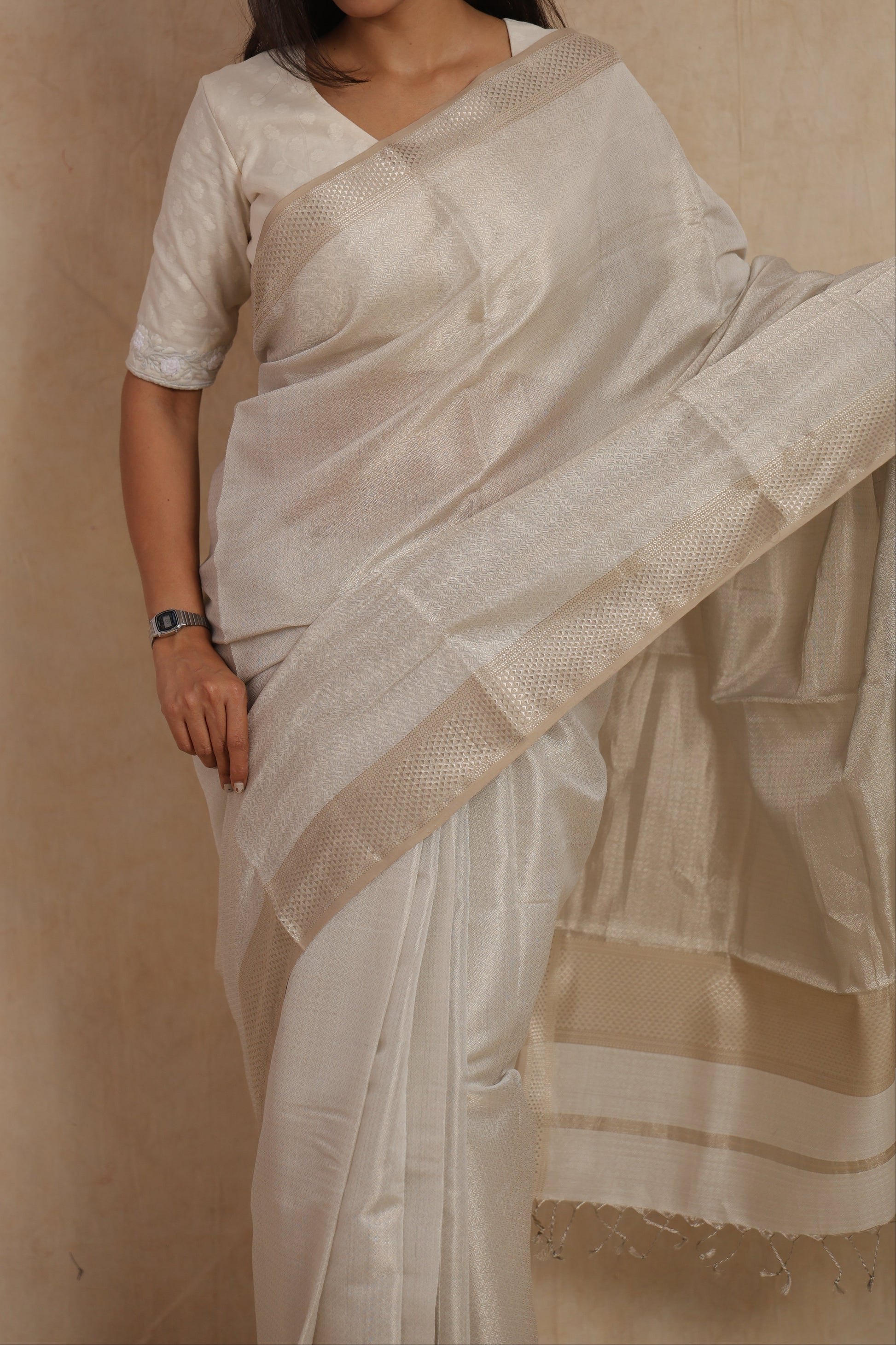 Close-up detail of pearl white Maheshwari handloom silk saree with textured weave