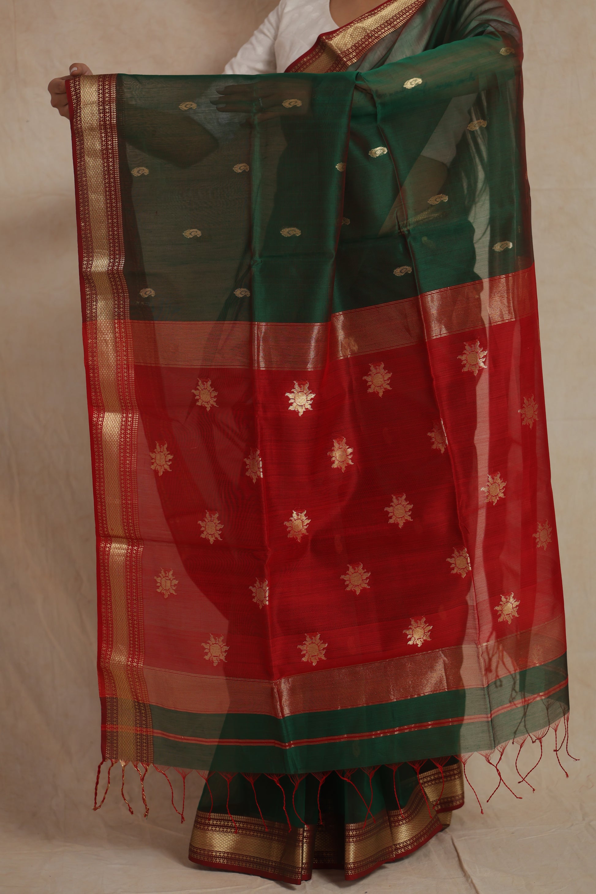 Bottle green Maheshwari handloom silk cotton saree with red contrast pallu and woven zari motifs