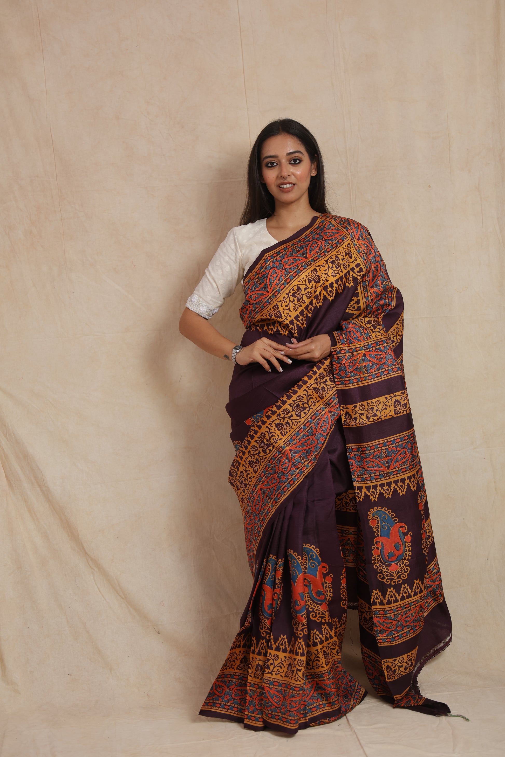 Royal aubergine Batik silk saree with multicolour paisley border and pallu