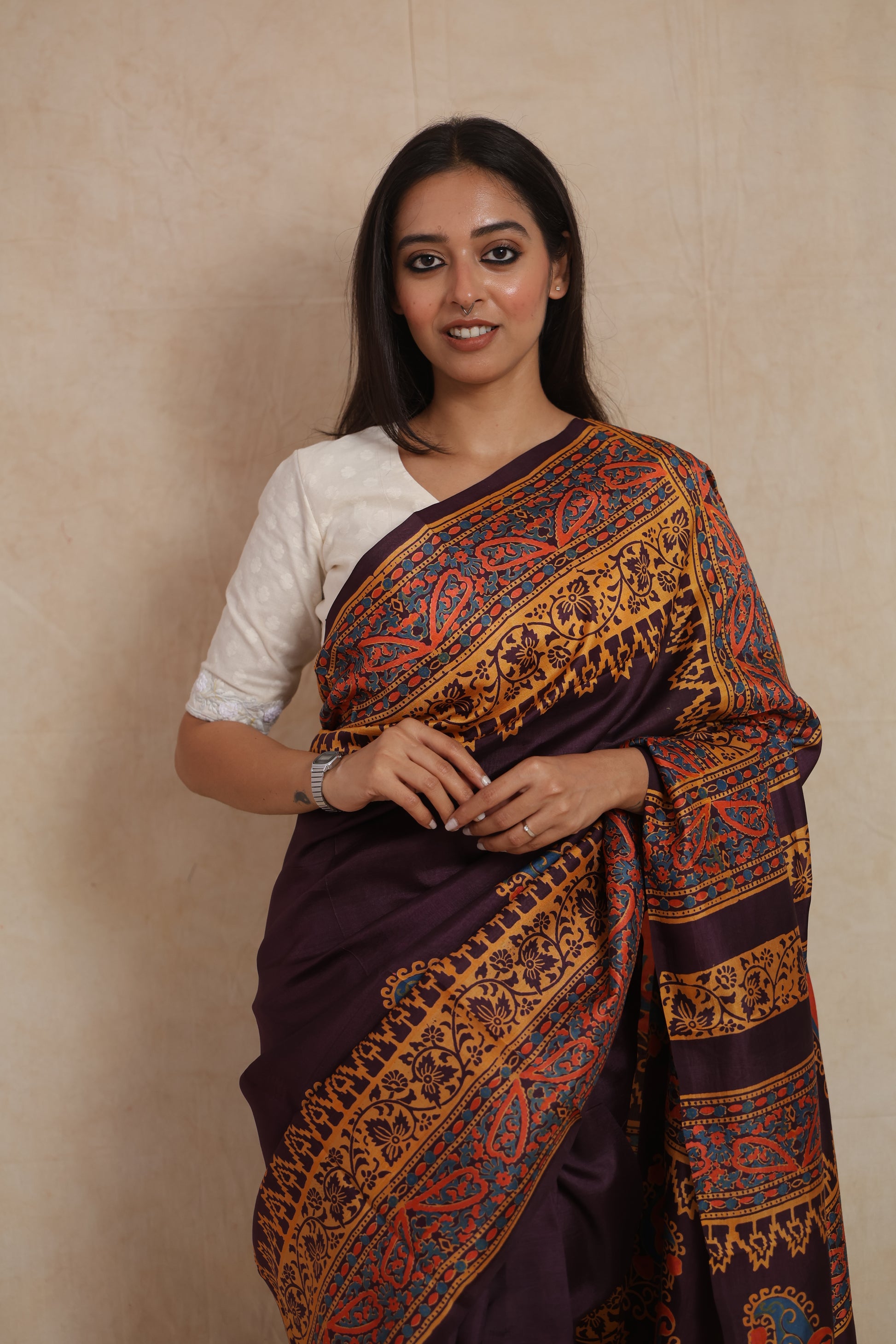 Elegant portrait view of royal aubergine Batik silk saree with traditional motifs