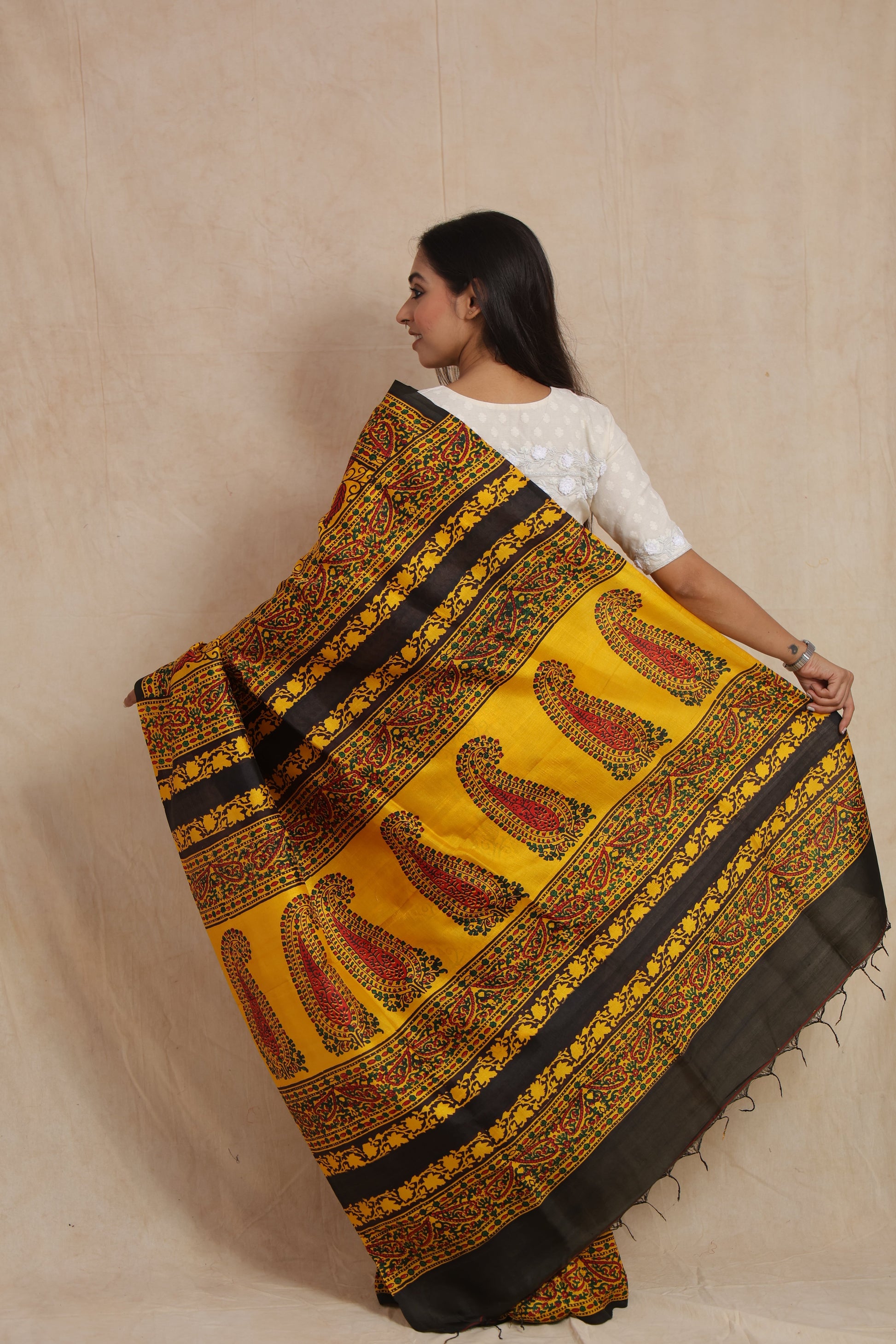Back view showcasing the ornate paisley pallu and decorative border of Batik silk saree