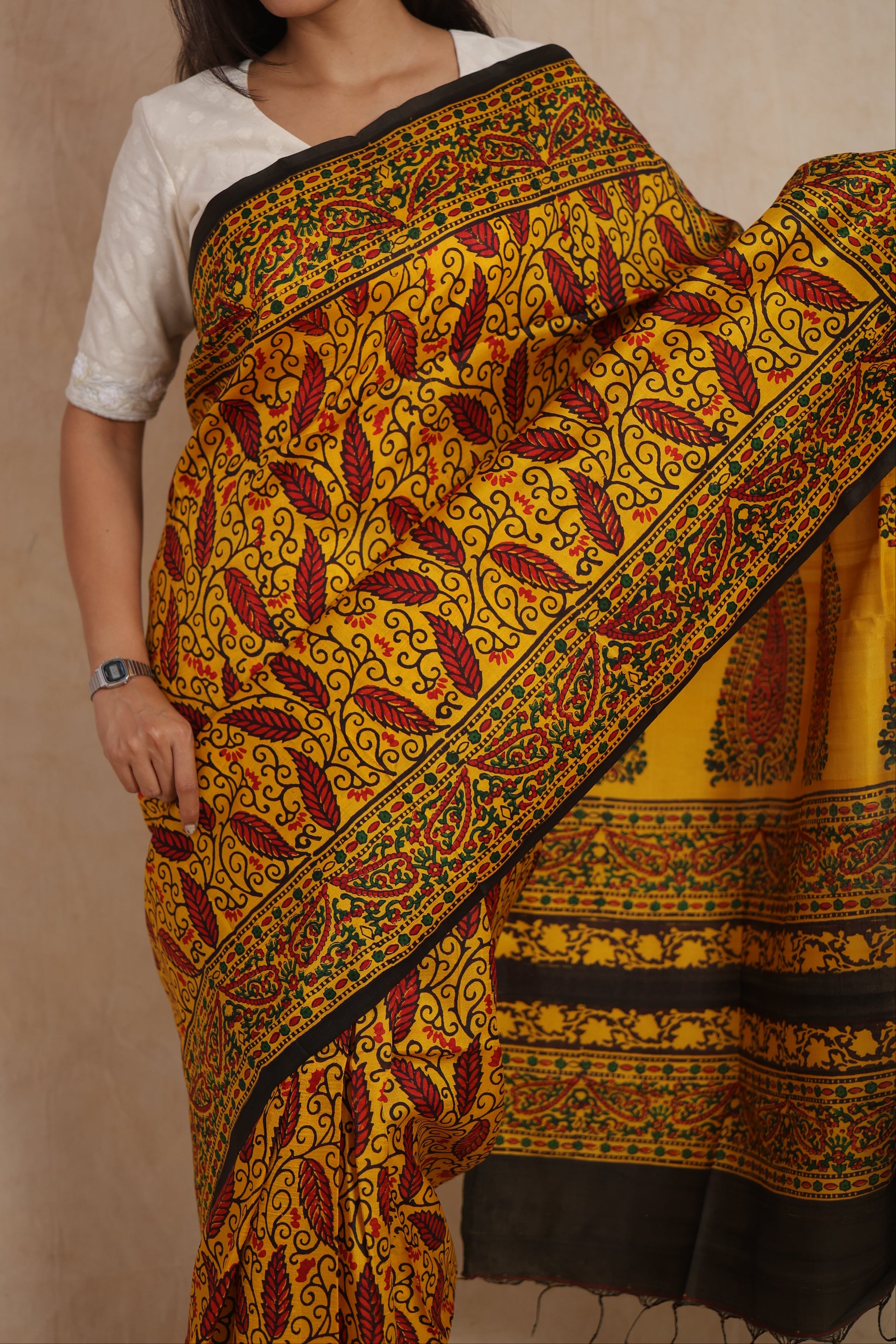 Detailed view of handcrafted Batik silk saree with paisley patterns and contrast border