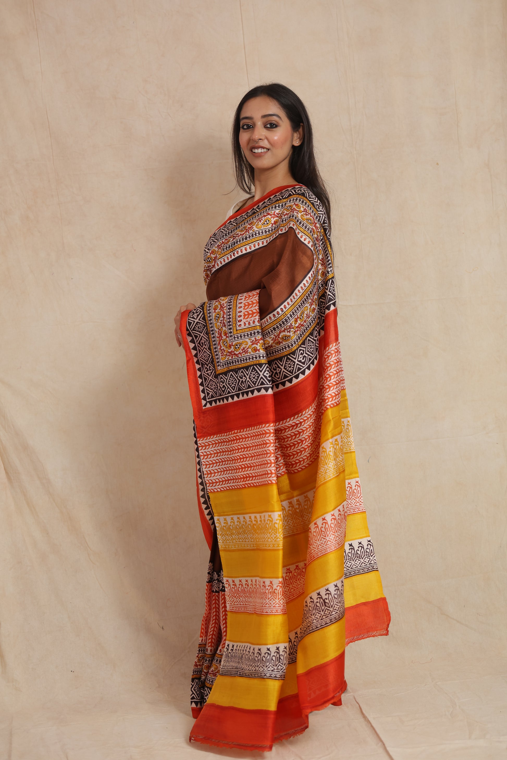 Side profile of Batik silk saree featuring detailed geometric and floral printed pallu