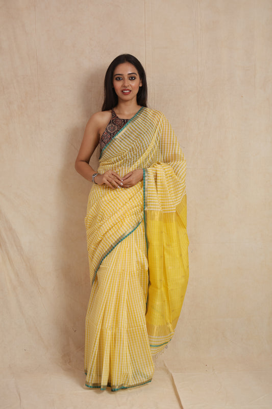 Model wearing sunshine yellow Maheshwari handloom silk saree front view