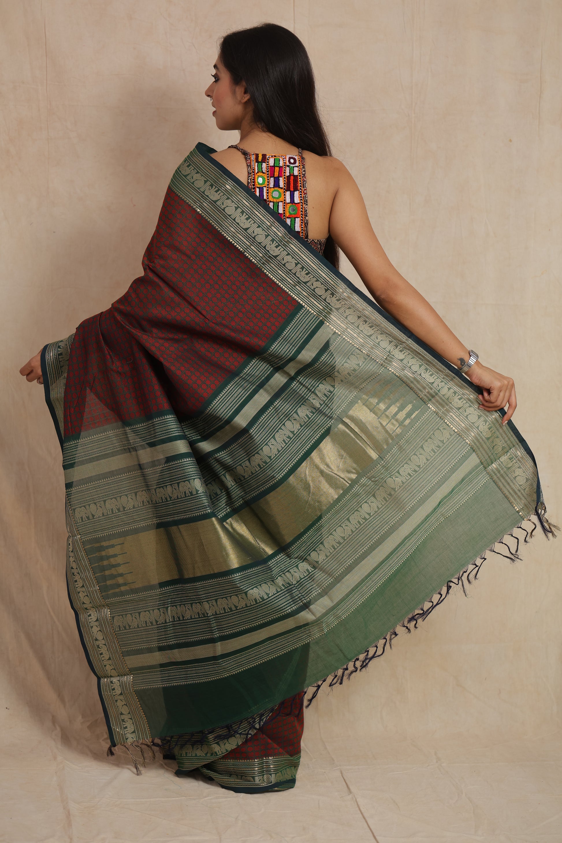 Back view showcasing the green pallu of Kanchipuram handloom cotton saree