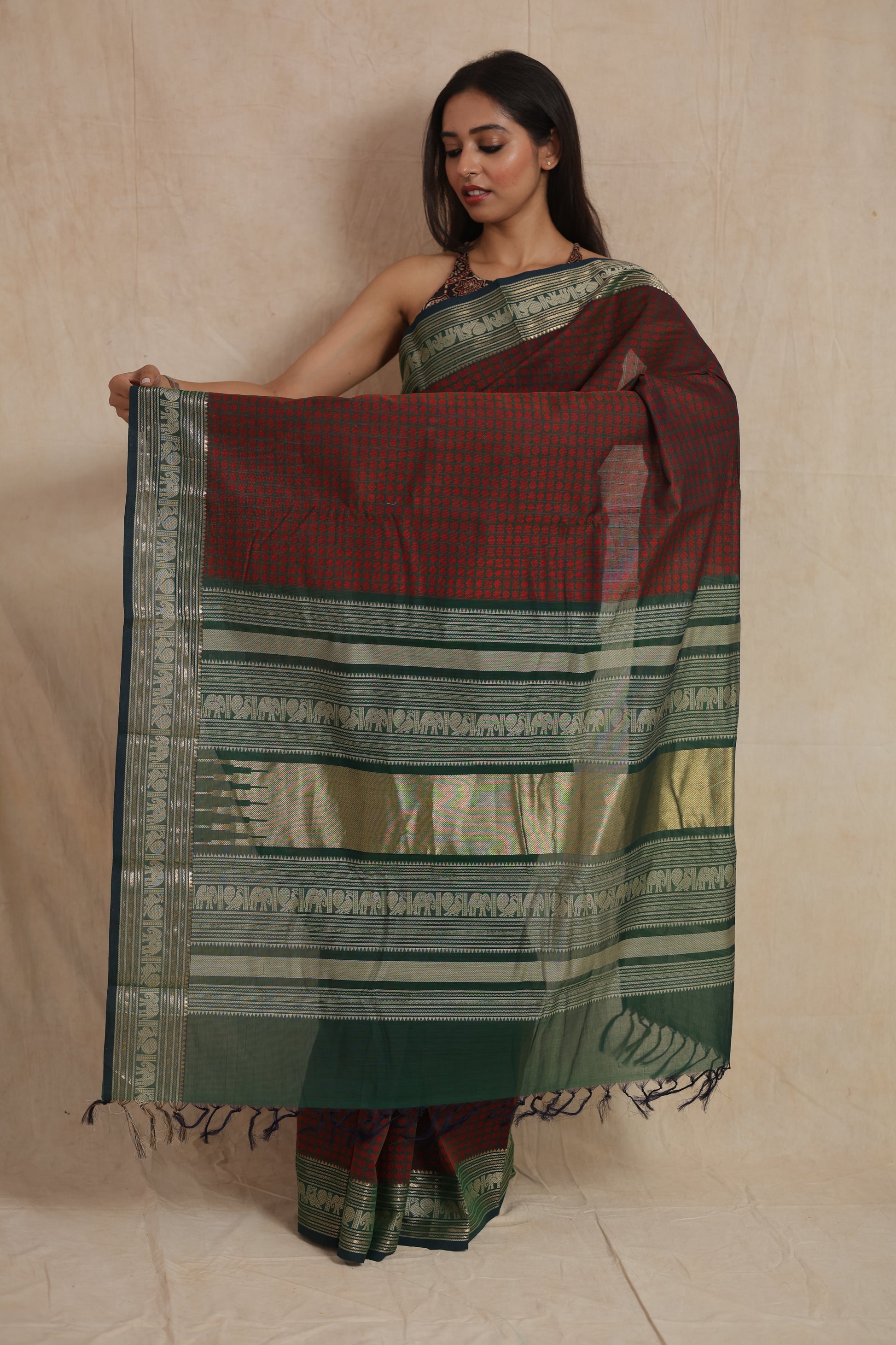 Traditional Kanchipuram cotton saree with detailed woven pallu and contrast border