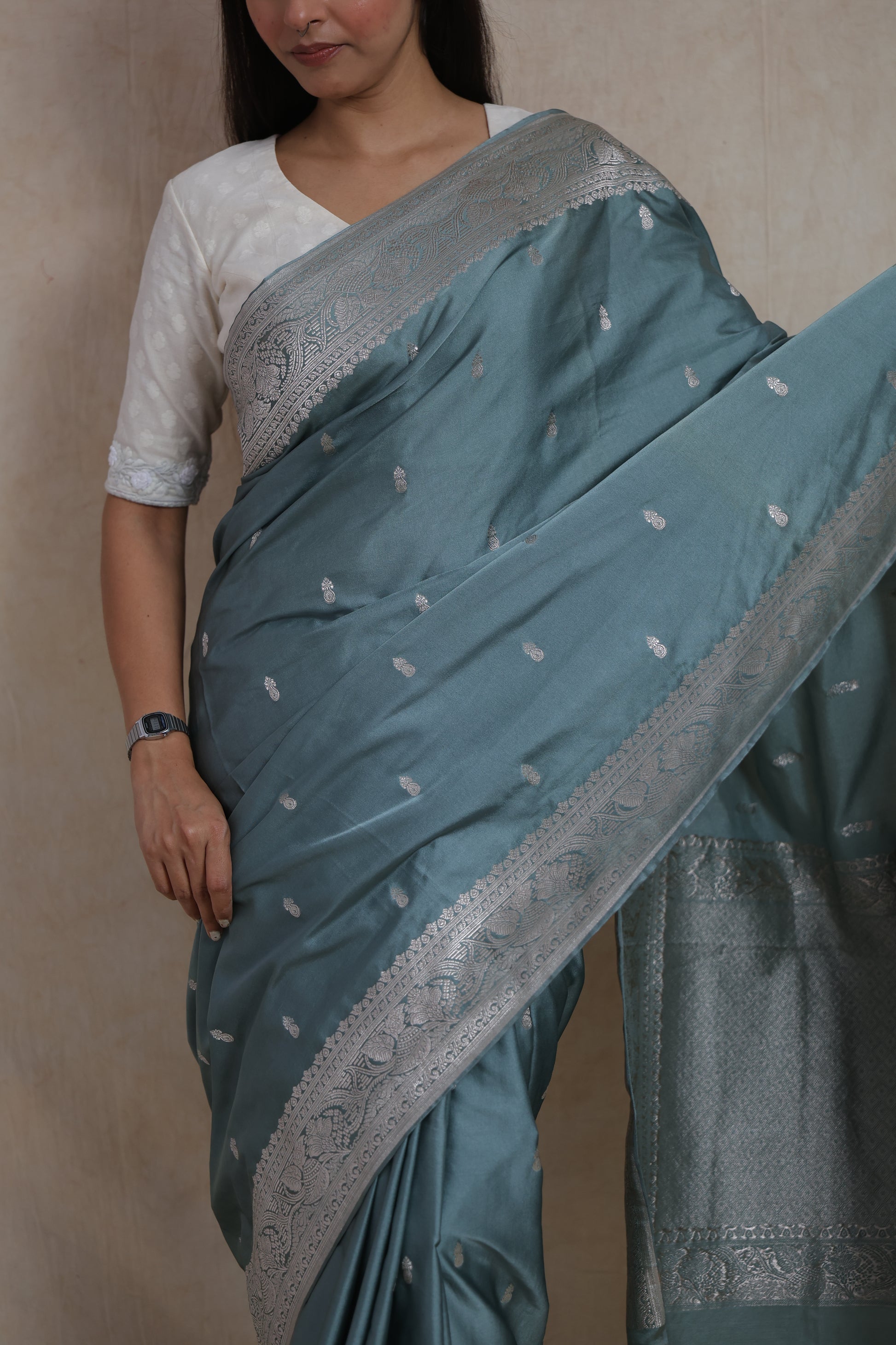 Portrait view of dusty blue Banarasi art silk saree with elegant silver motifs and traditional craftsmanship