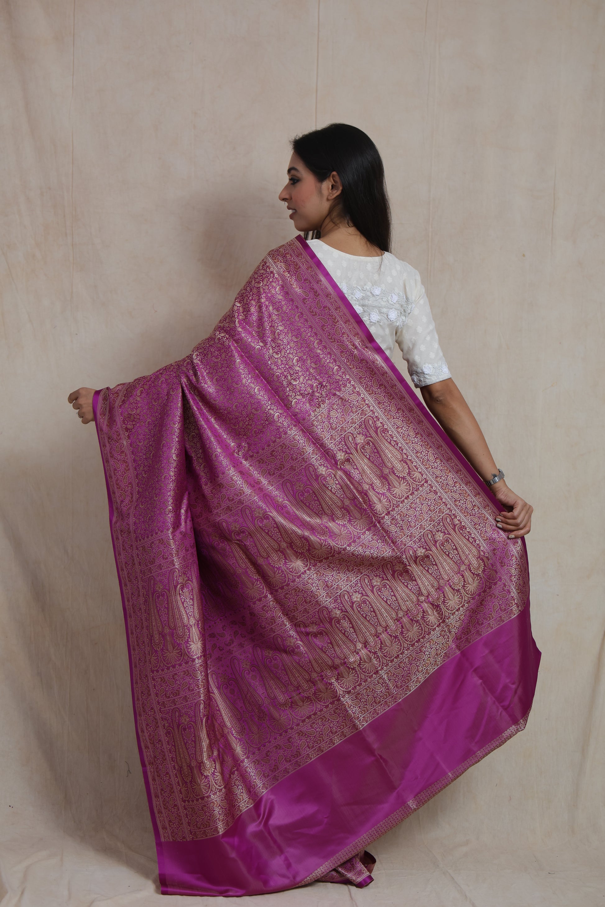 Back view of magenta Banarasi silk saree showcasing the richly woven traditional pallu