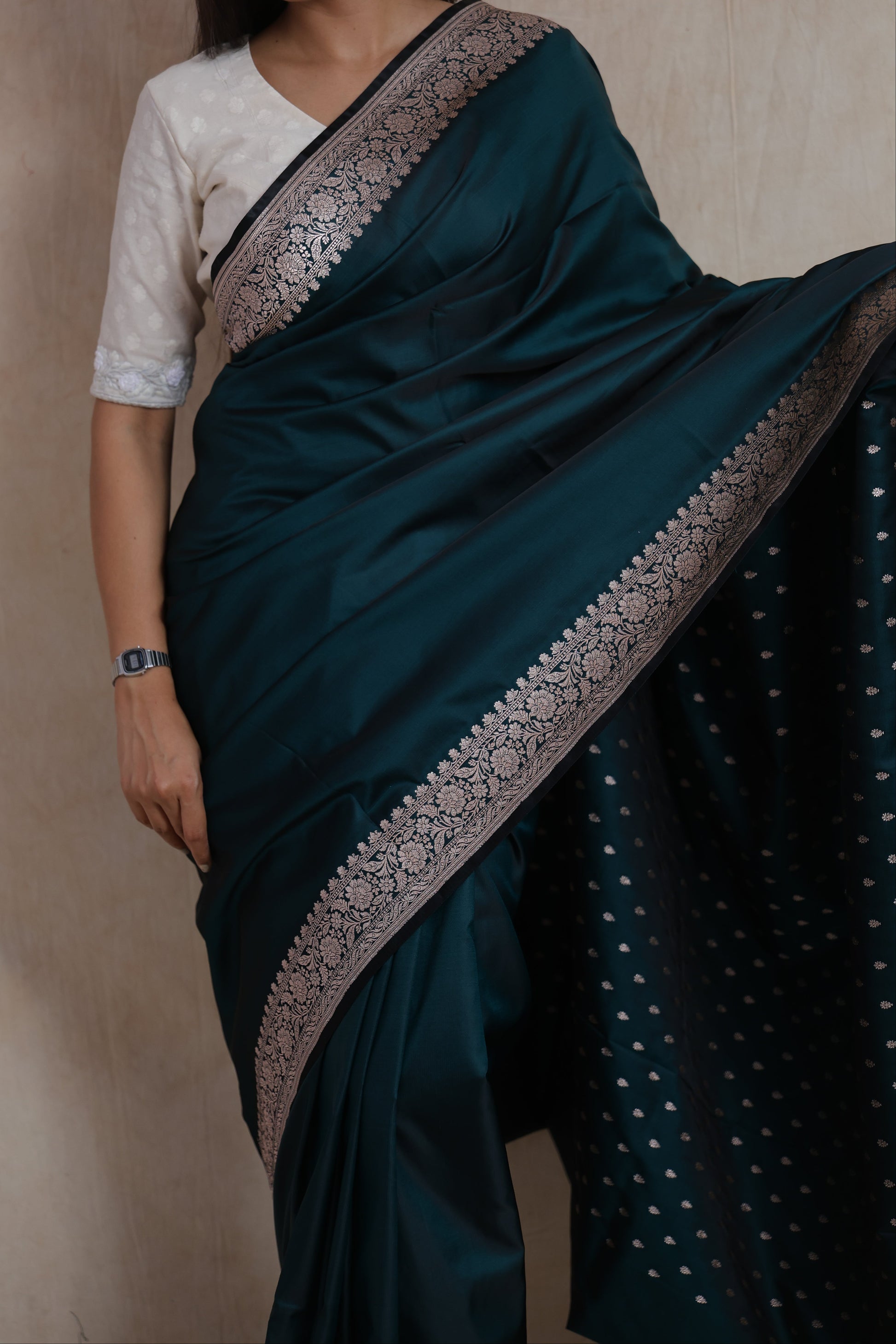 Portrait view of midnight teal Banarasi art silk saree with elegant traditional woven border
