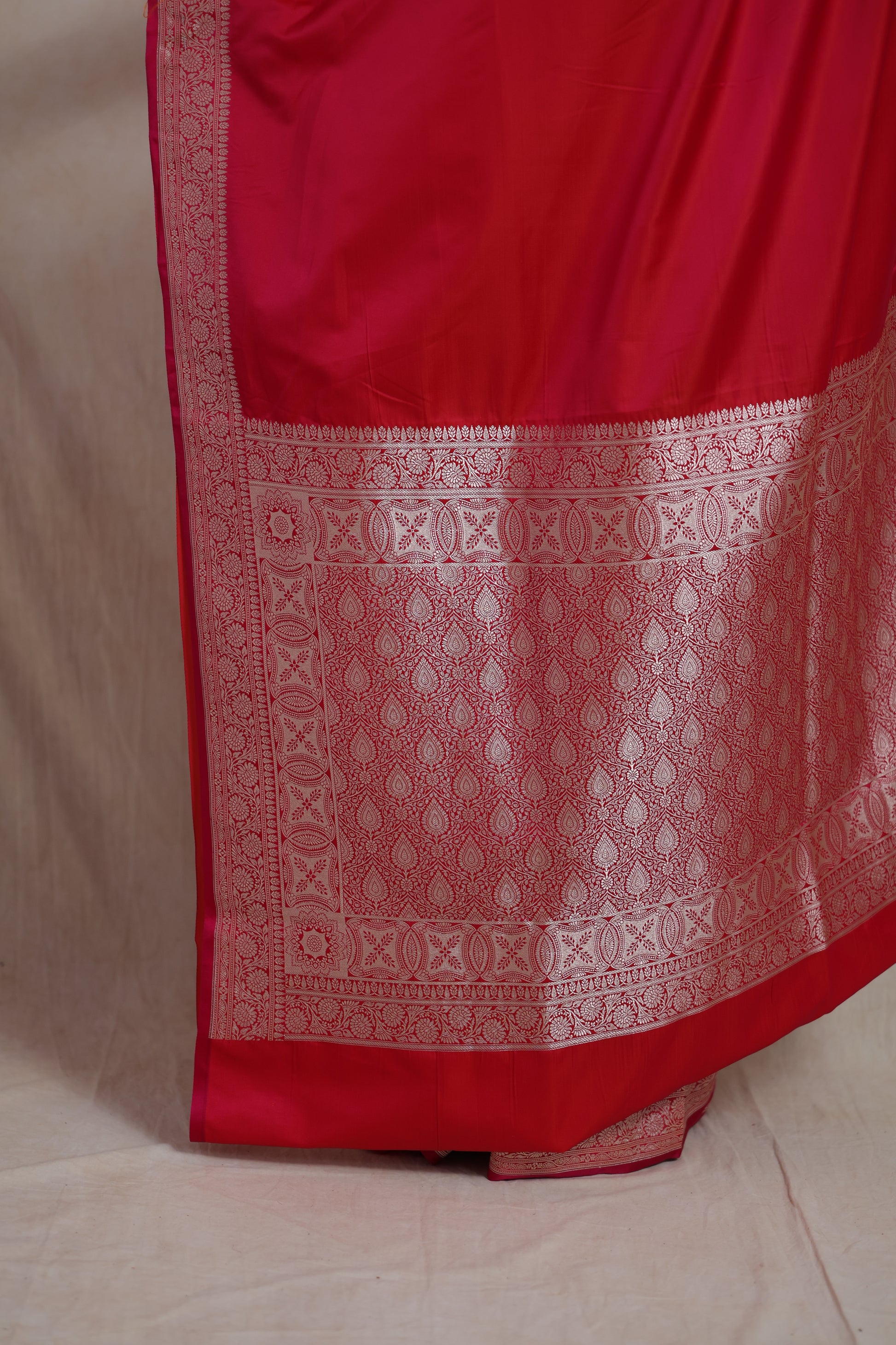Close-up of the Banarasi silk saree pallu with intricate silver zari weaving