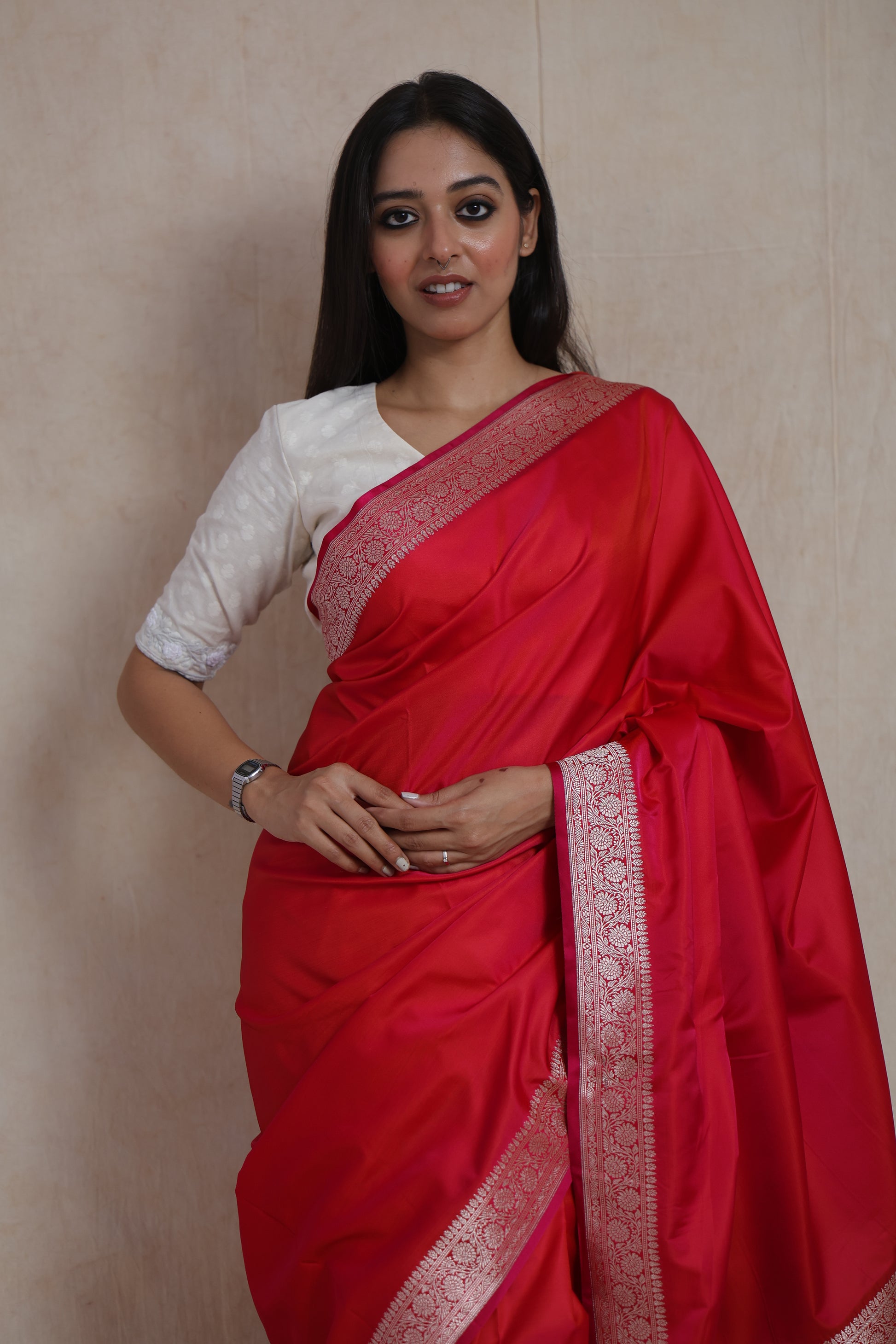 Detailed view of the ruby red Banarasi silk saree body and woven border