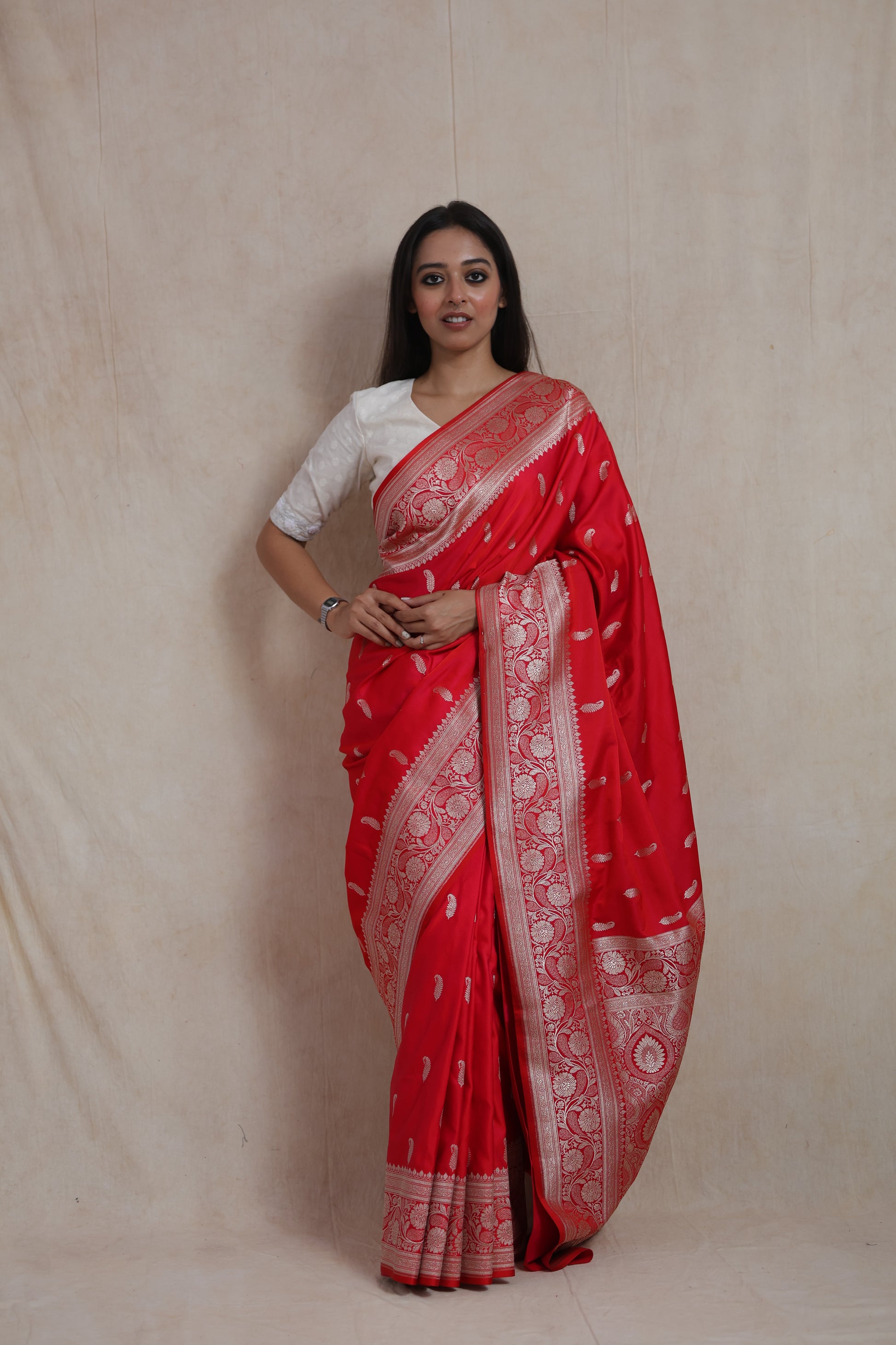 Front view of royal crimson Banarasi art silk saree with woven buttas and floral border