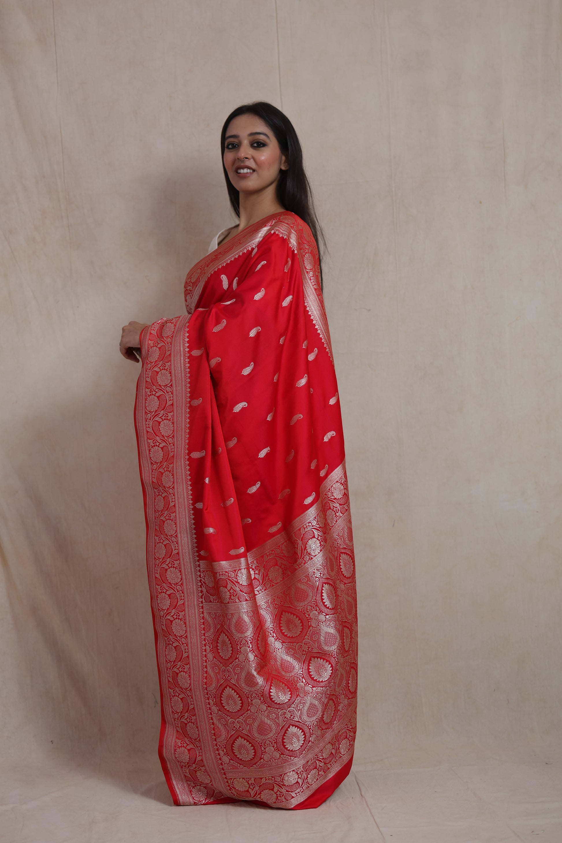 Side profile of crimson Banarasi art silk saree showcasing intricate woven border