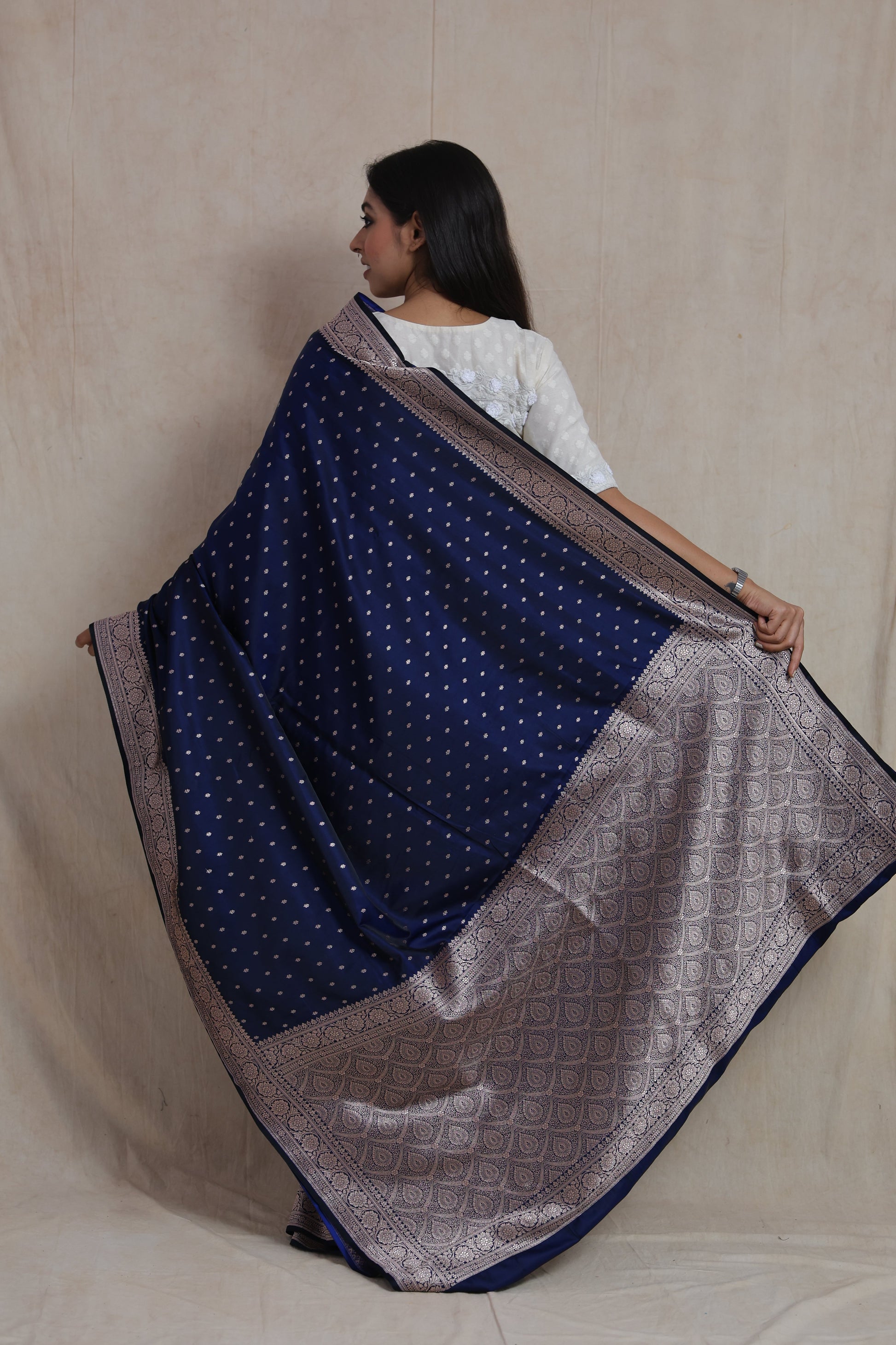 Back view of Banarasi silk saree showcasing intricate silver woven pallu and border