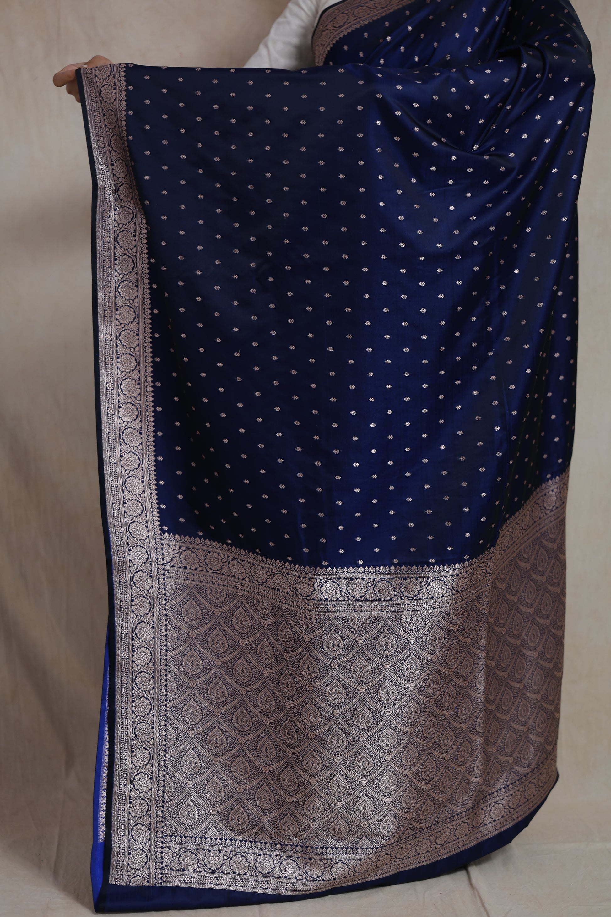 Detailed view of richly woven Banarasi pallu with traditional silver motifs