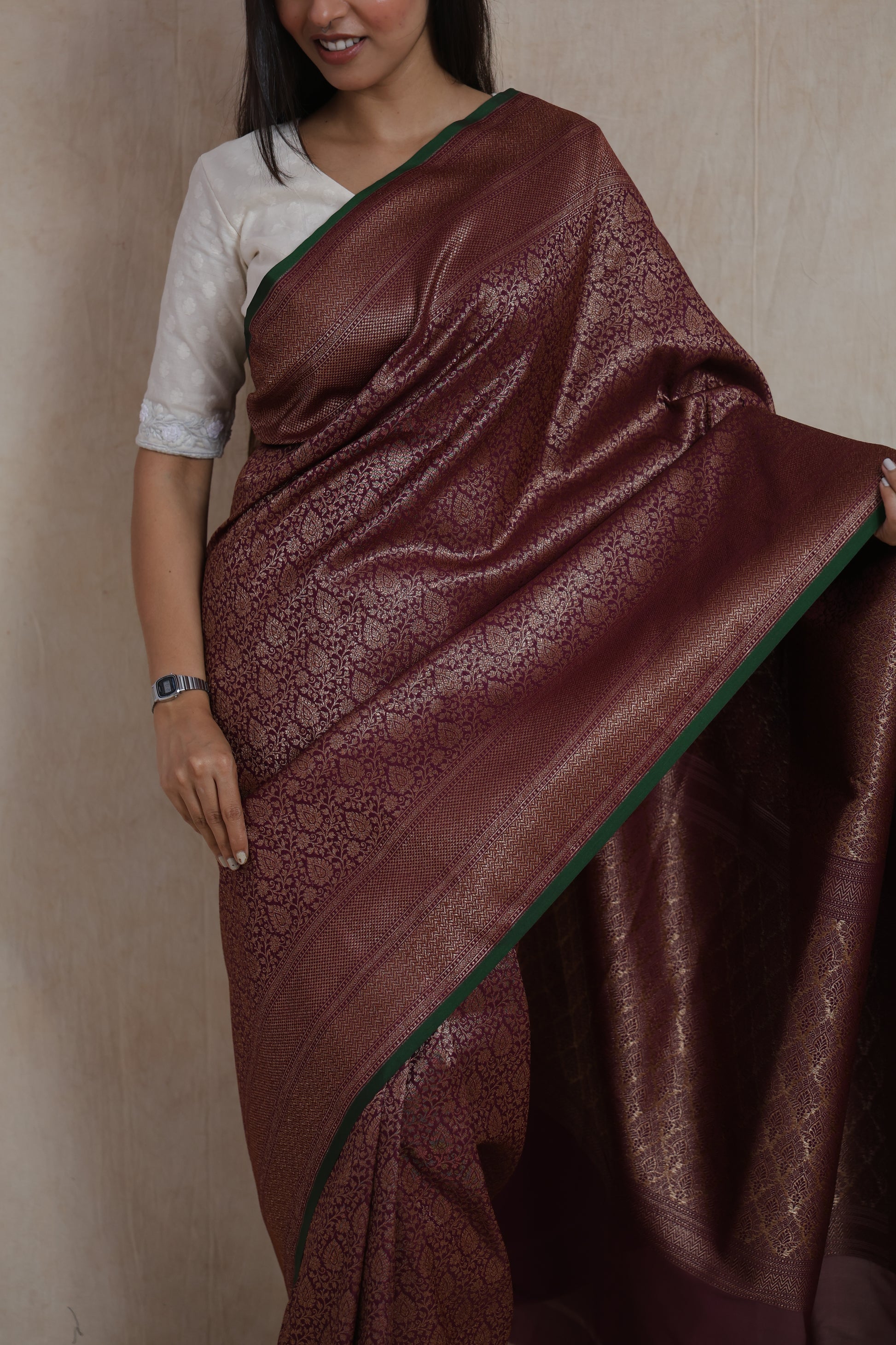 Portrait view of the wine purple Banarasi silk saree highlighting the intricate woven craftsmanship