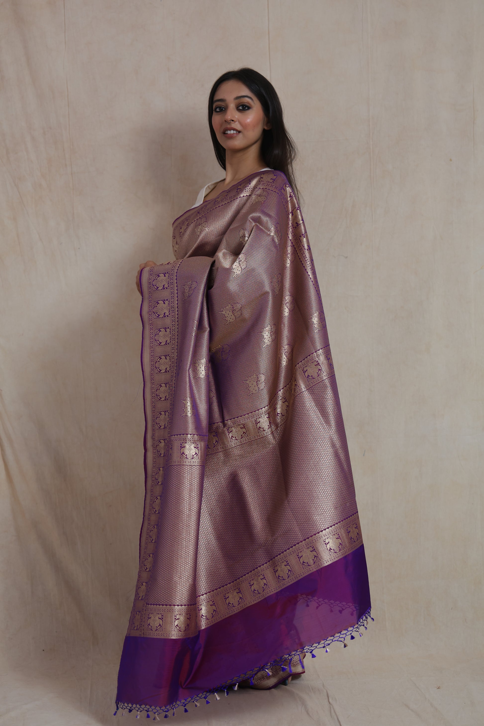 Side profile of mauve Banarasi silk saree featuring traditional elephant motif border