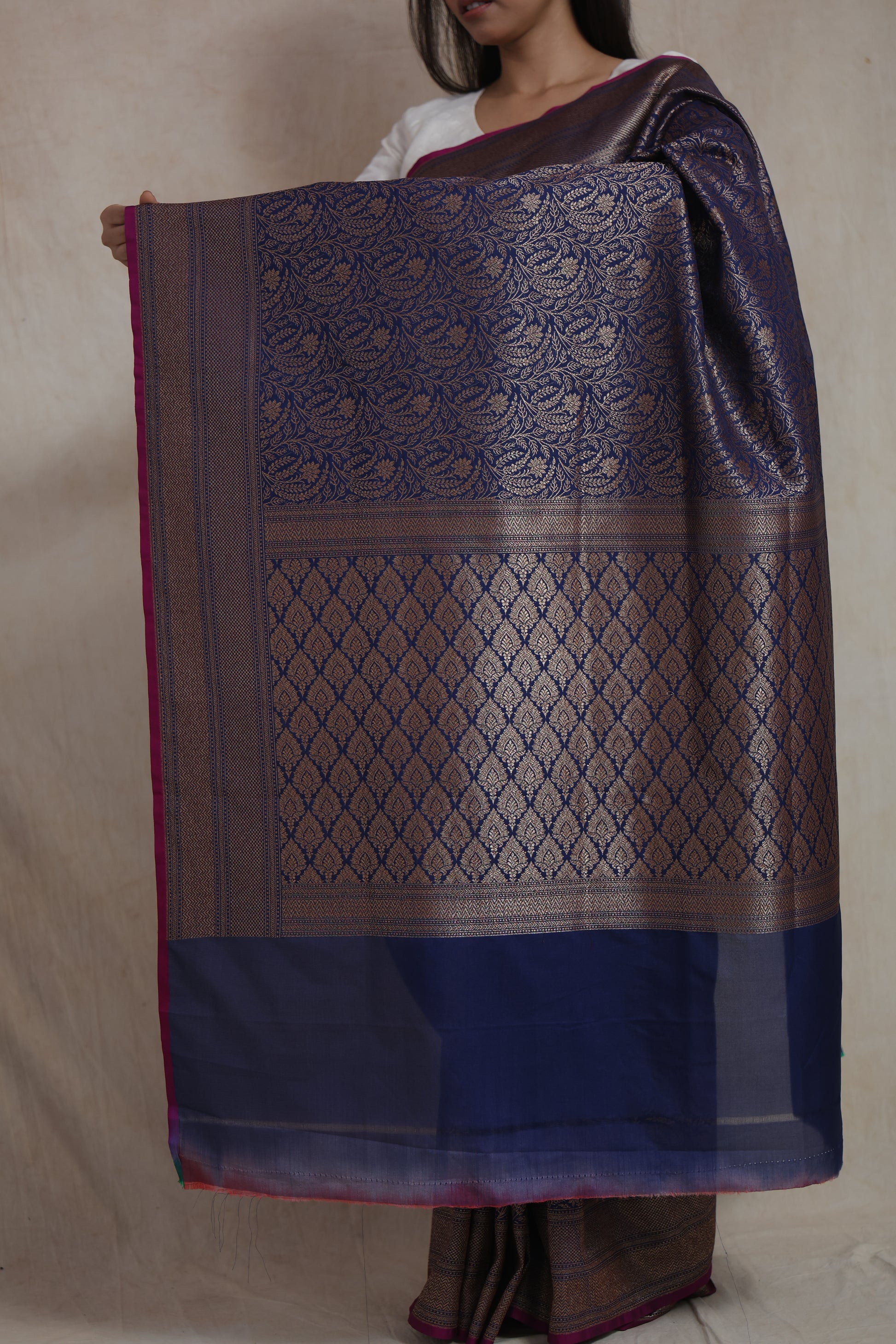 Close-up of the Banarasi silk pallu featuring traditional antique gold motifs