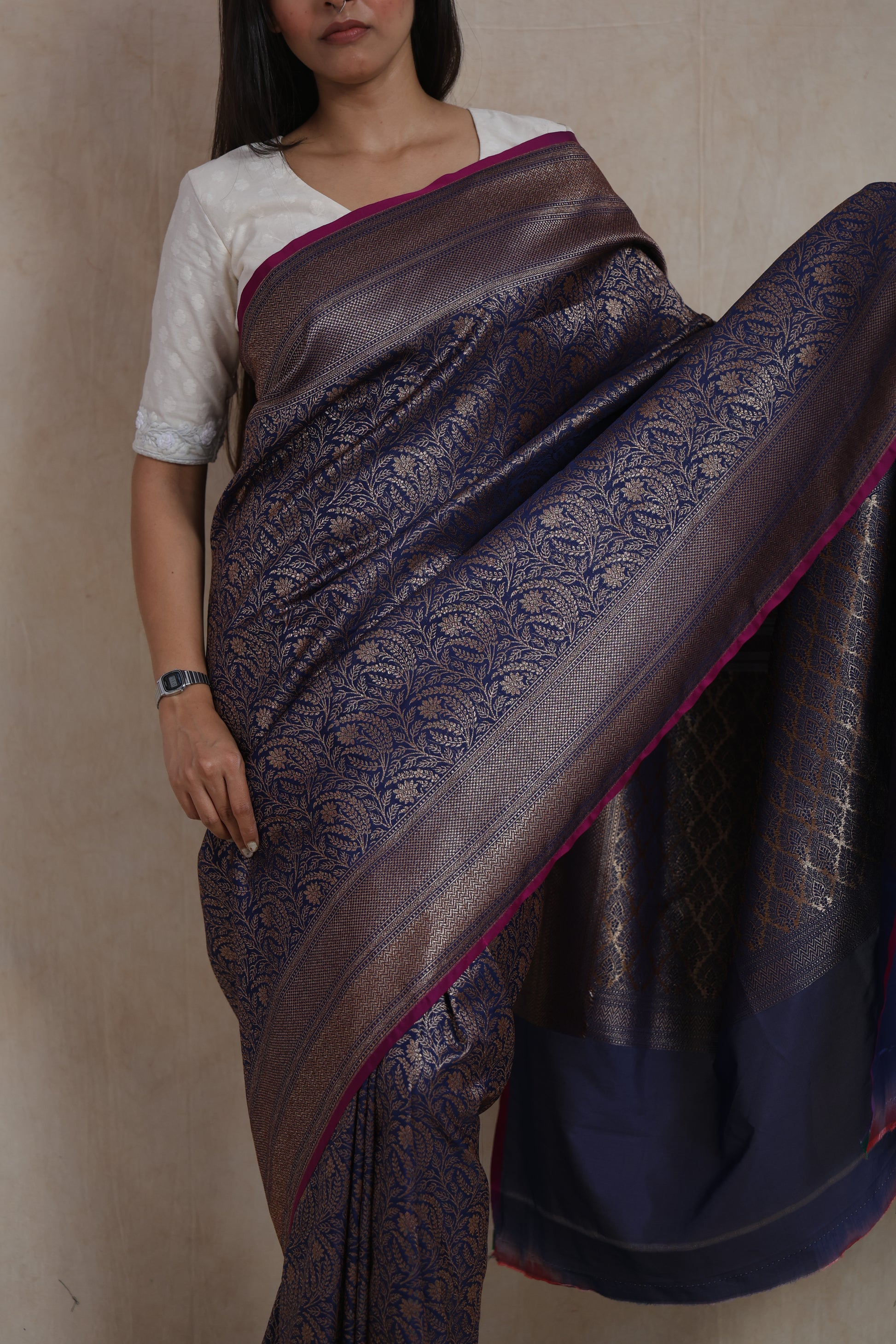 Close-up of the Banarasi silk pallu featuring traditional antique gold motifs