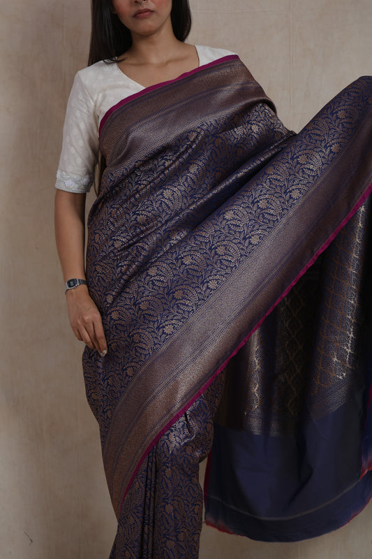 Close-up of the Banarasi silk pallu featuring traditional antique gold motifs