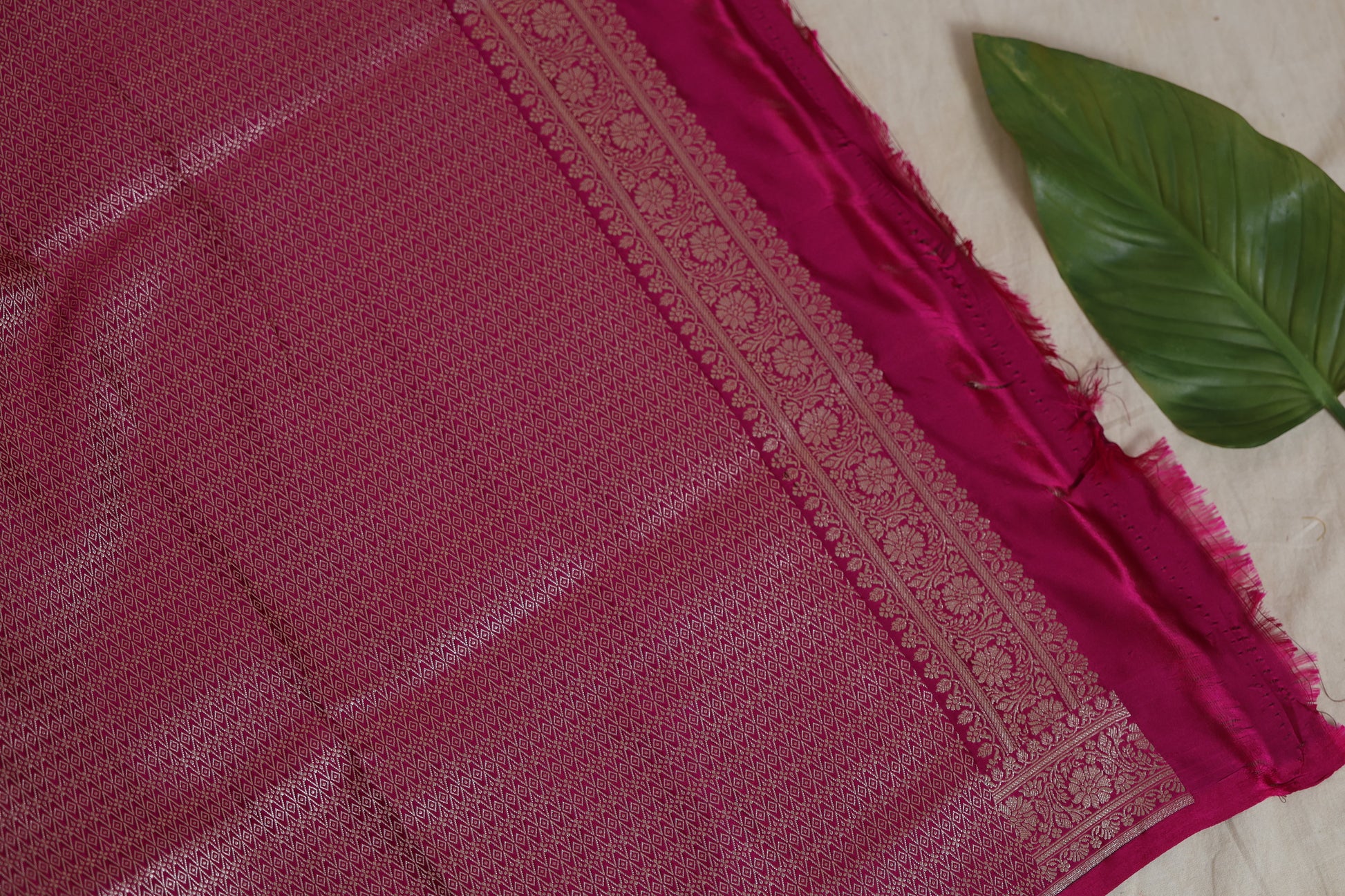 Detailed view of the richly woven pink Banarasi silk pallu and border