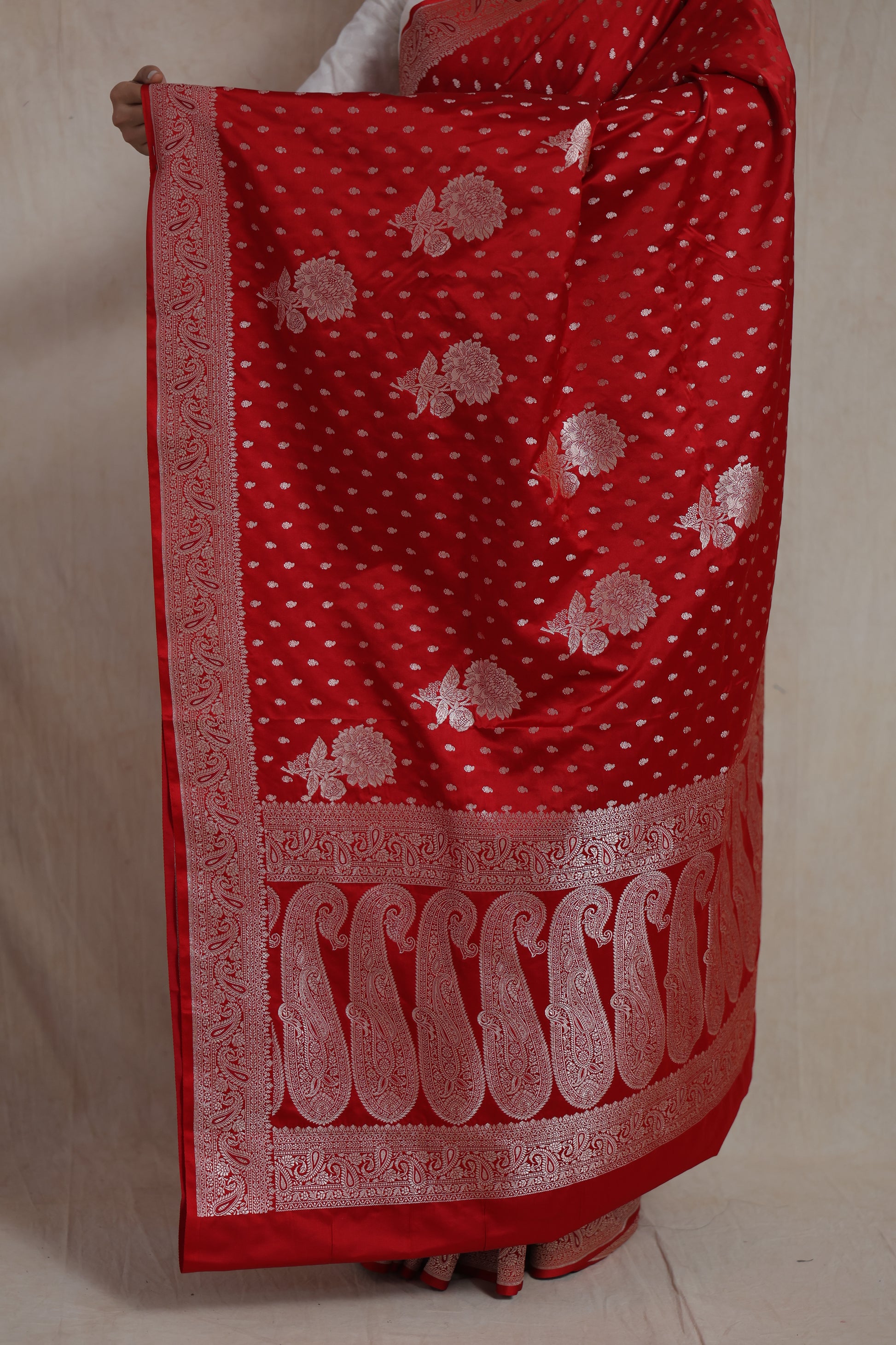 Detailed view of Banarasi art silk saree pallu with traditional paisley and floral woven patterns