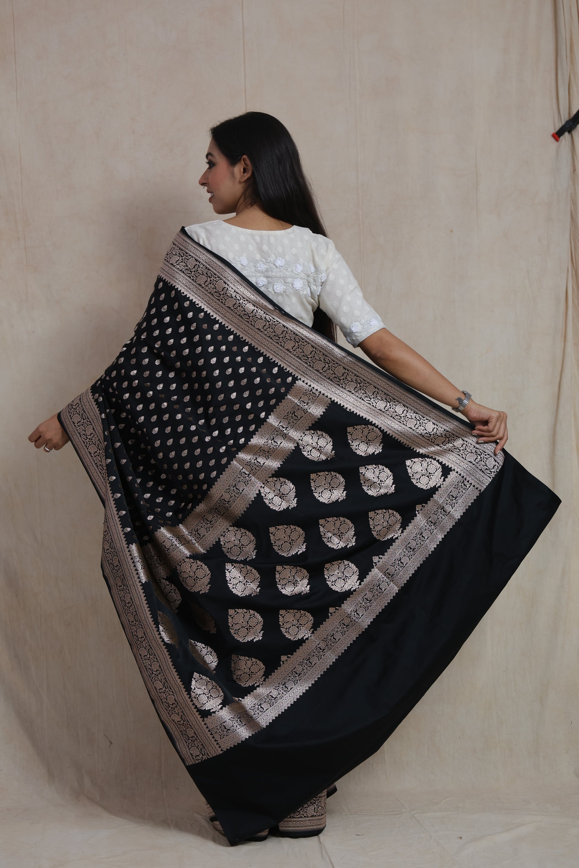 Black Banarasi art silk saree with silver woven buttas and intricate floral border