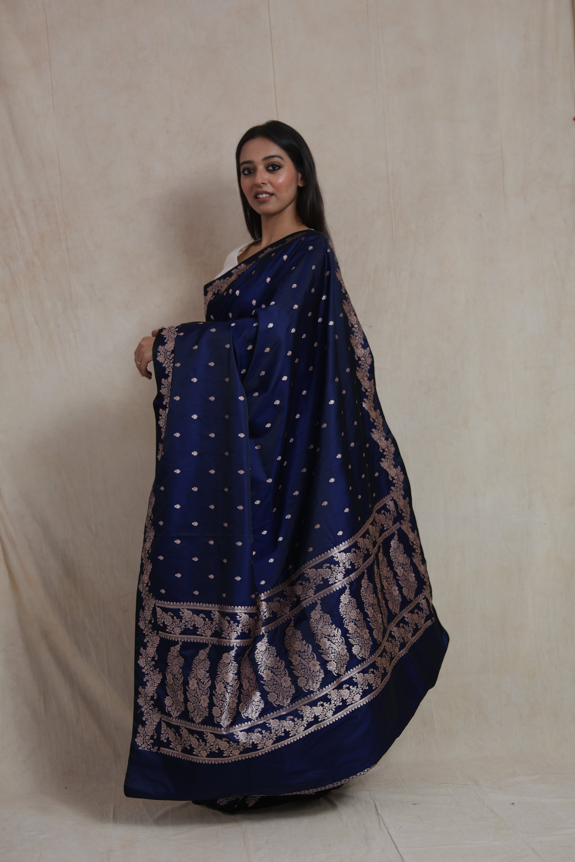 Side view of royal navy blue Banarasi art silk saree featuring detailed floral woven pallu