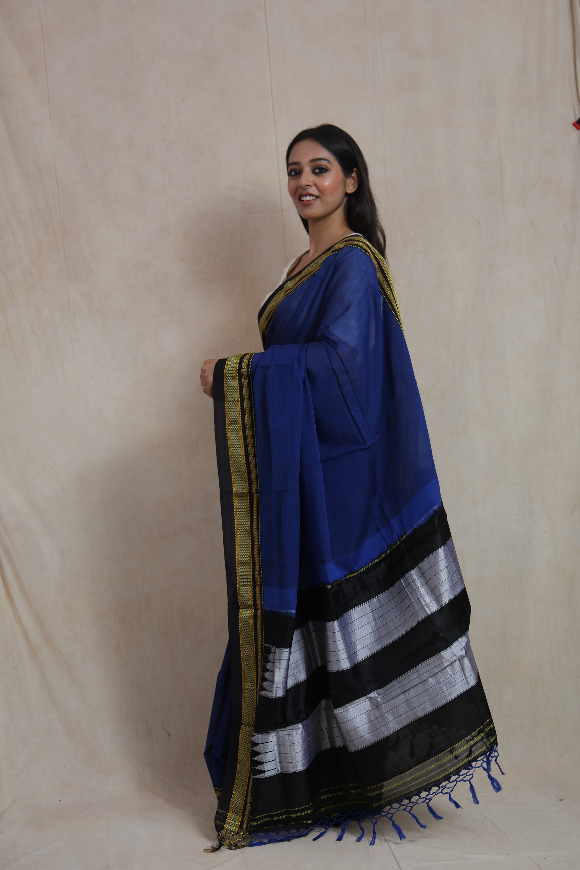 Side profile of royal blue Ilkal cotton saree showcasing traditional woven border details