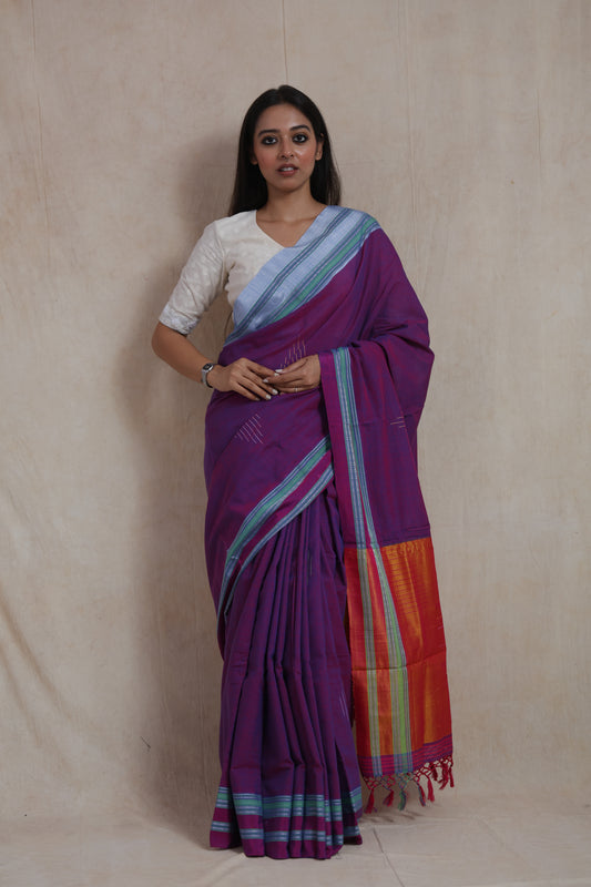 Model wearing royal purple Ilkal handloom cotton saree with contrast orange pallu