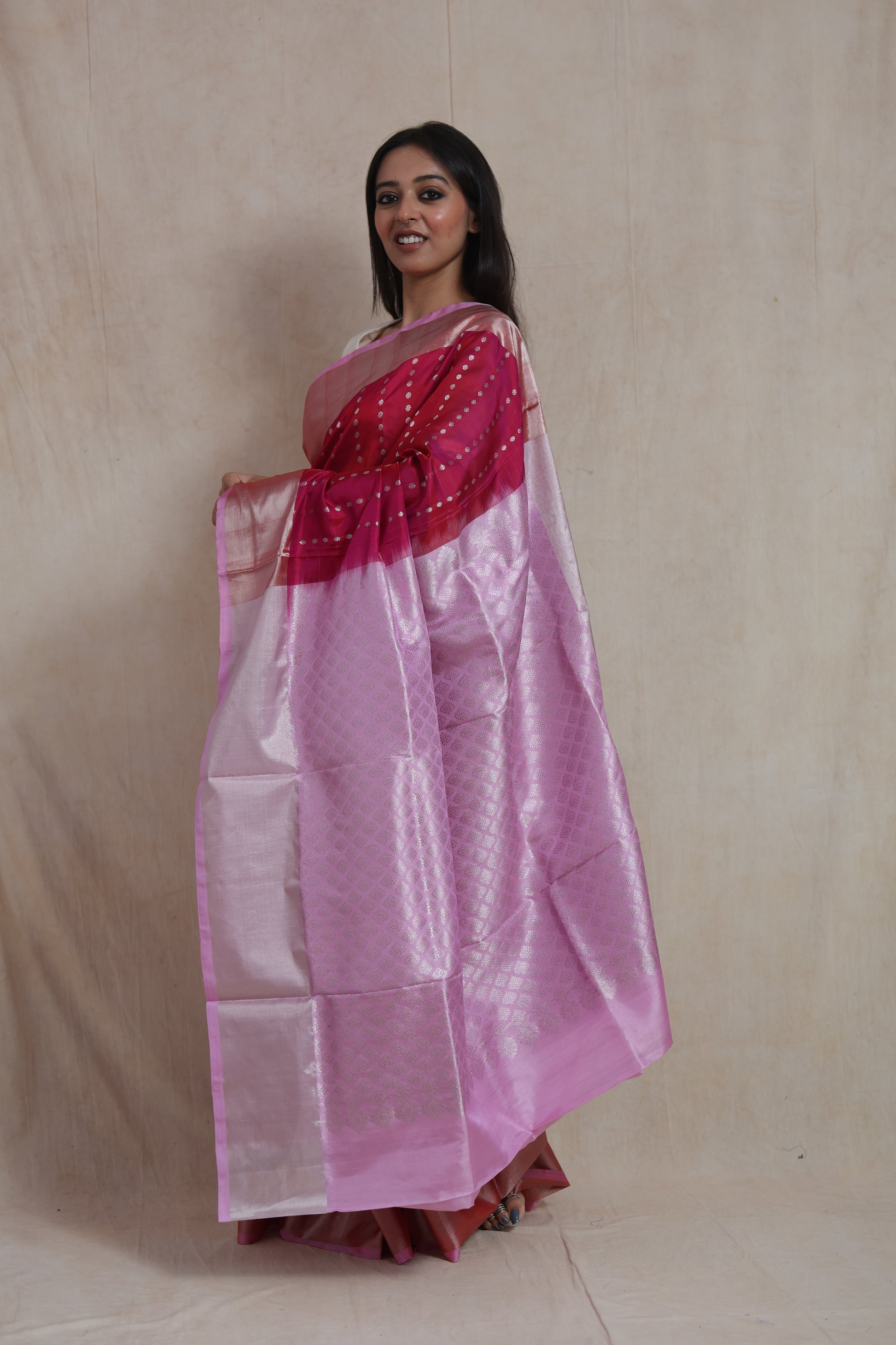 Side view of Kanjivaram silk saree featuring silver woven dotted motifs and elegant silver border