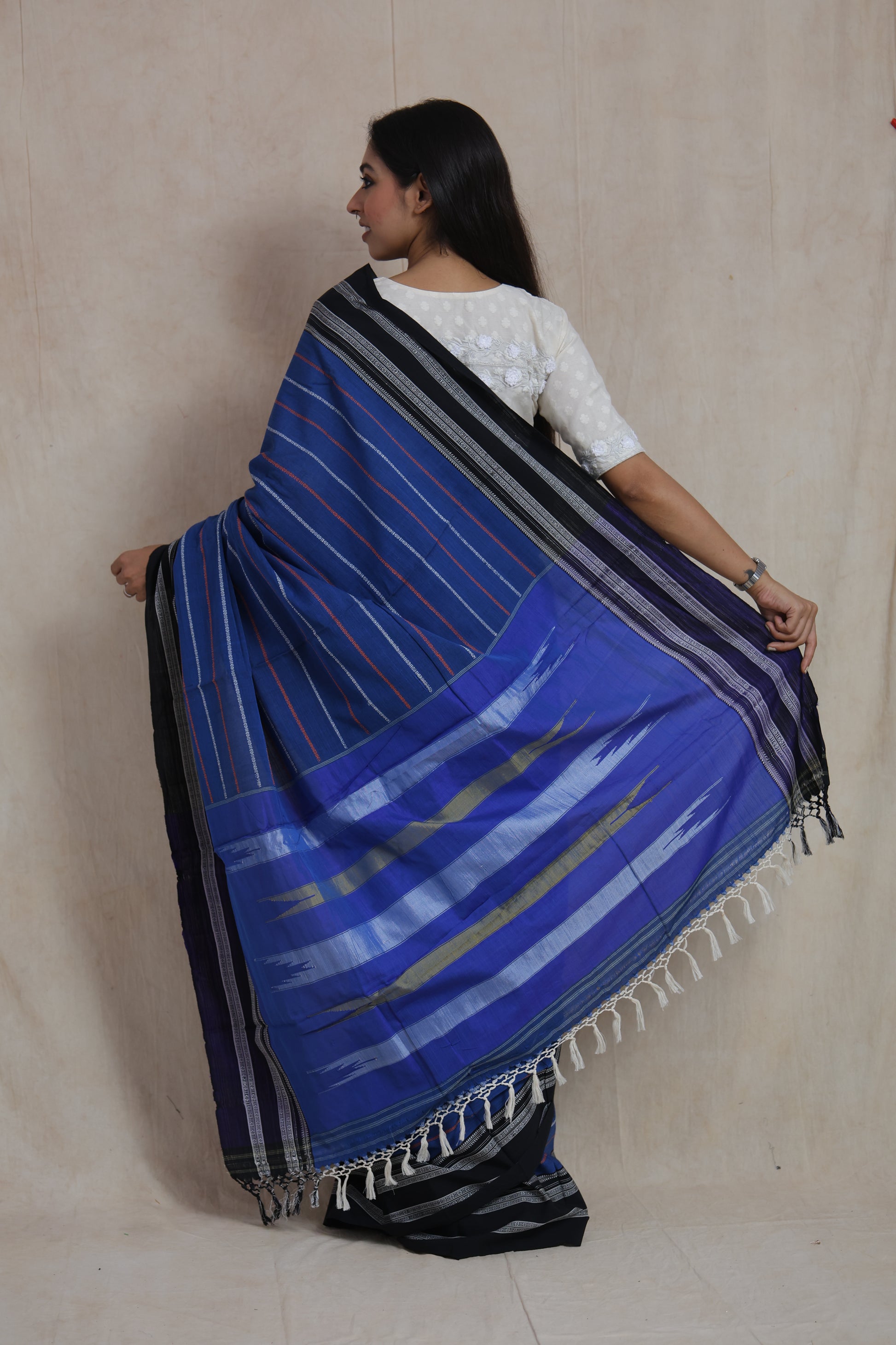 Back view showcasing traditional Ilkal saree pallu with woven striped details