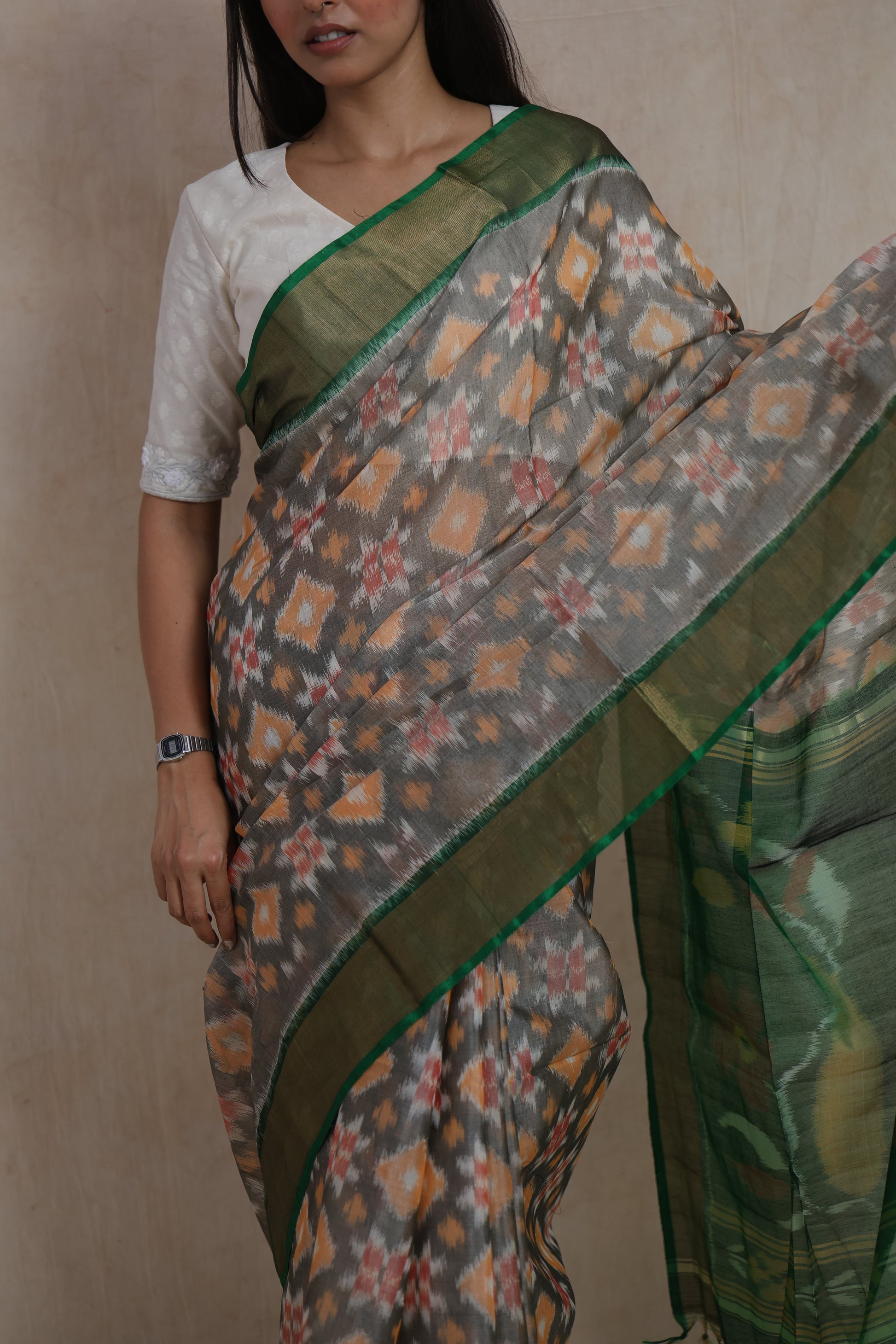 Close-up of traditional ikat motifs on grey Pochampally SICO saree body