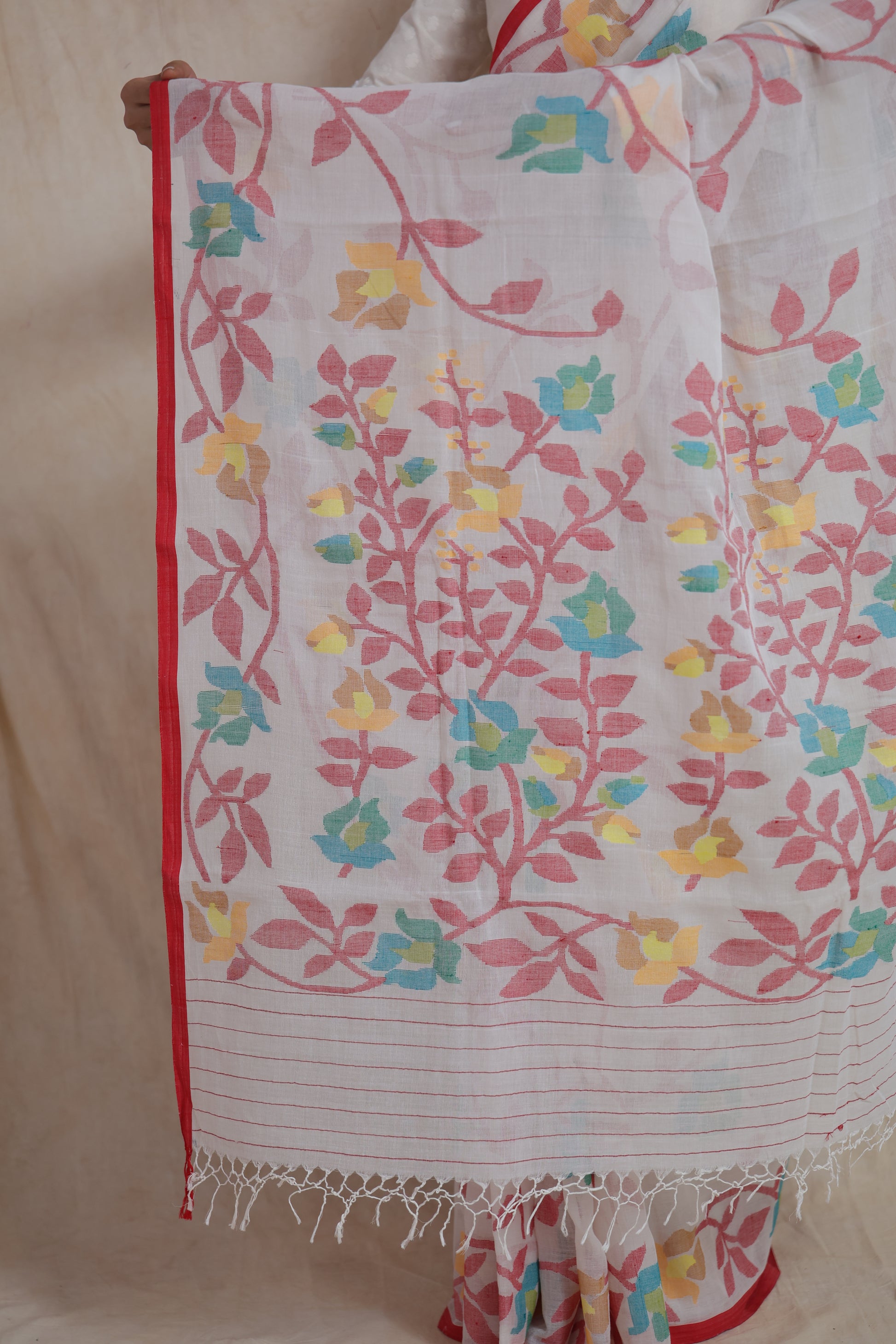 Detailed view of Bengal Cotton Fulia saree with floral vine border, red edging and soft cotton texture