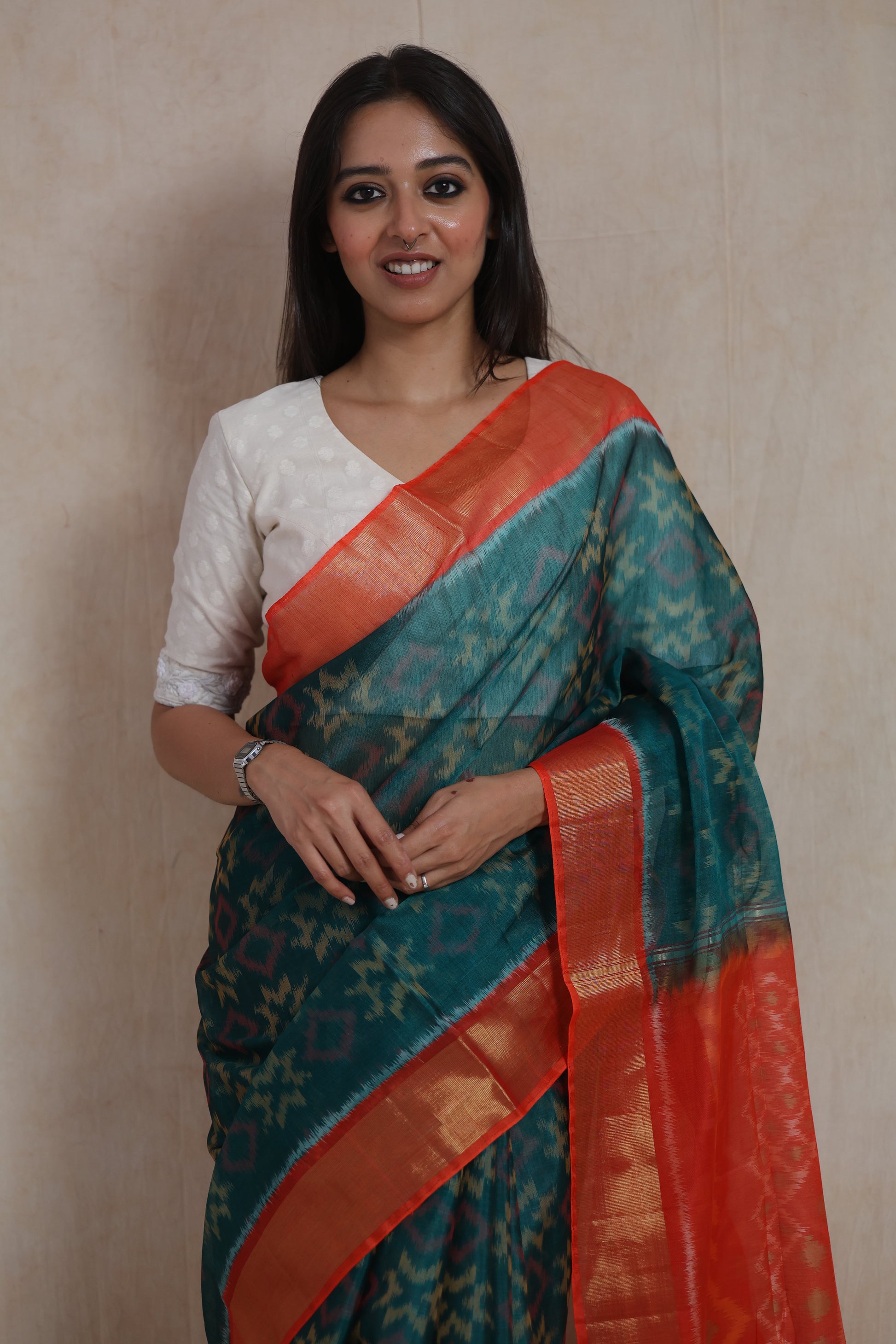 Front close-up of teal blue Panchampali silk cotton saree with traditional ikat-inspired patterns
