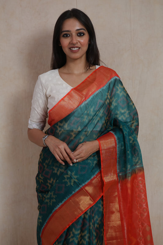 Front close-up of teal blue Panchampali silk cotton saree with traditional ikat-inspired patterns