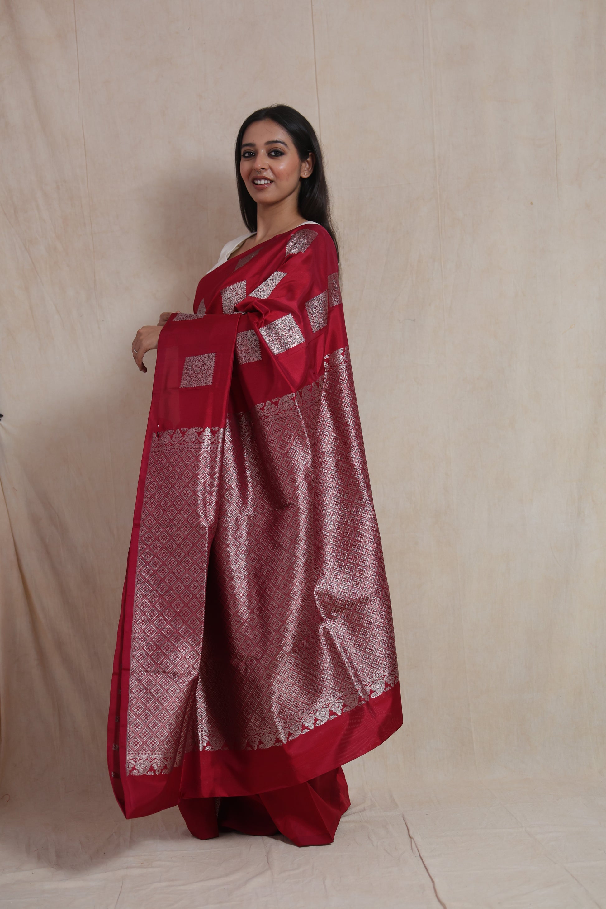 Detailed view of the saree body featuring elegant silver woven buttas on luxurious Venkatgiri silk.