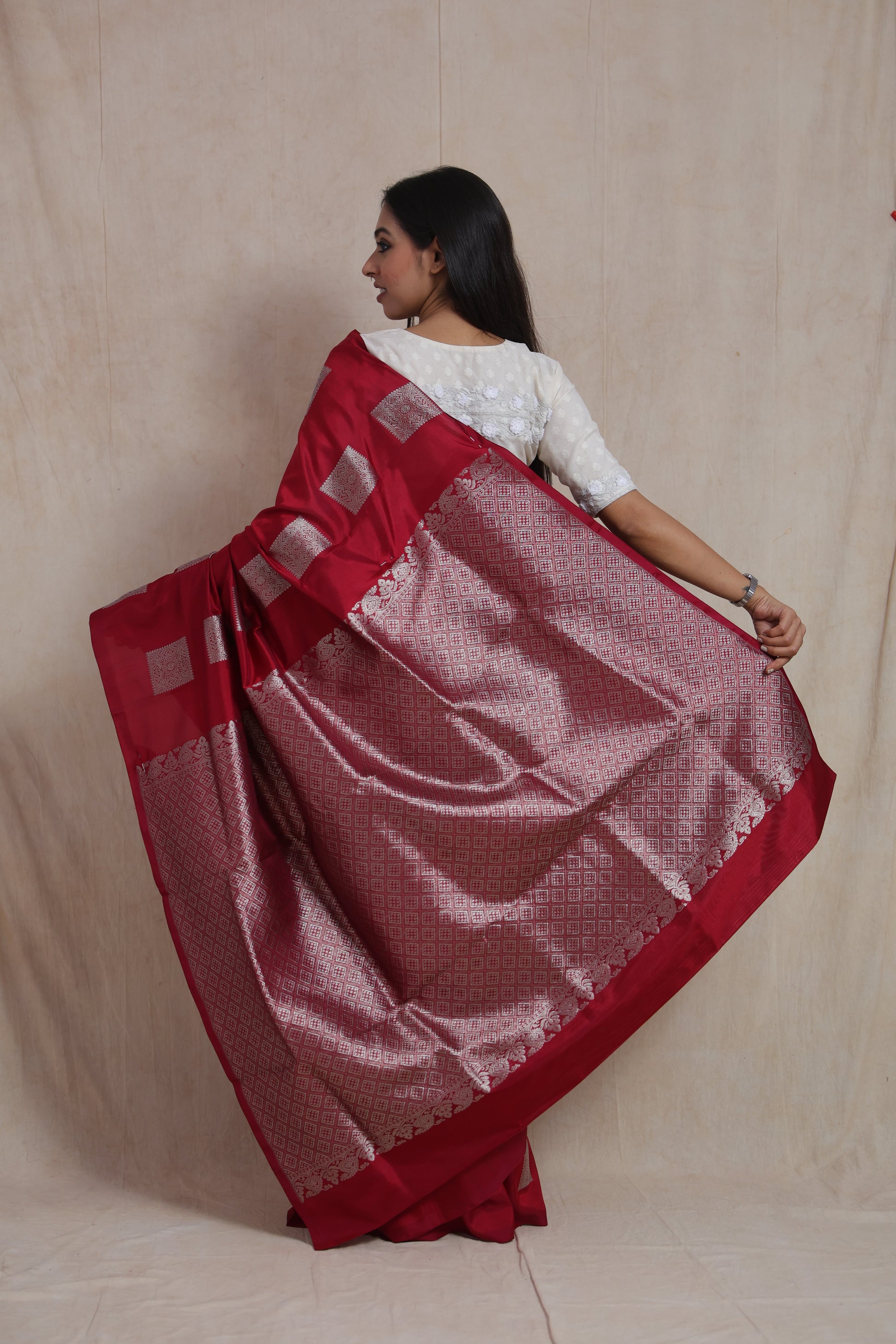 Back view of the crimson red Venkatgiri silk saree showcasing its beautifully woven pallu and traditional border.