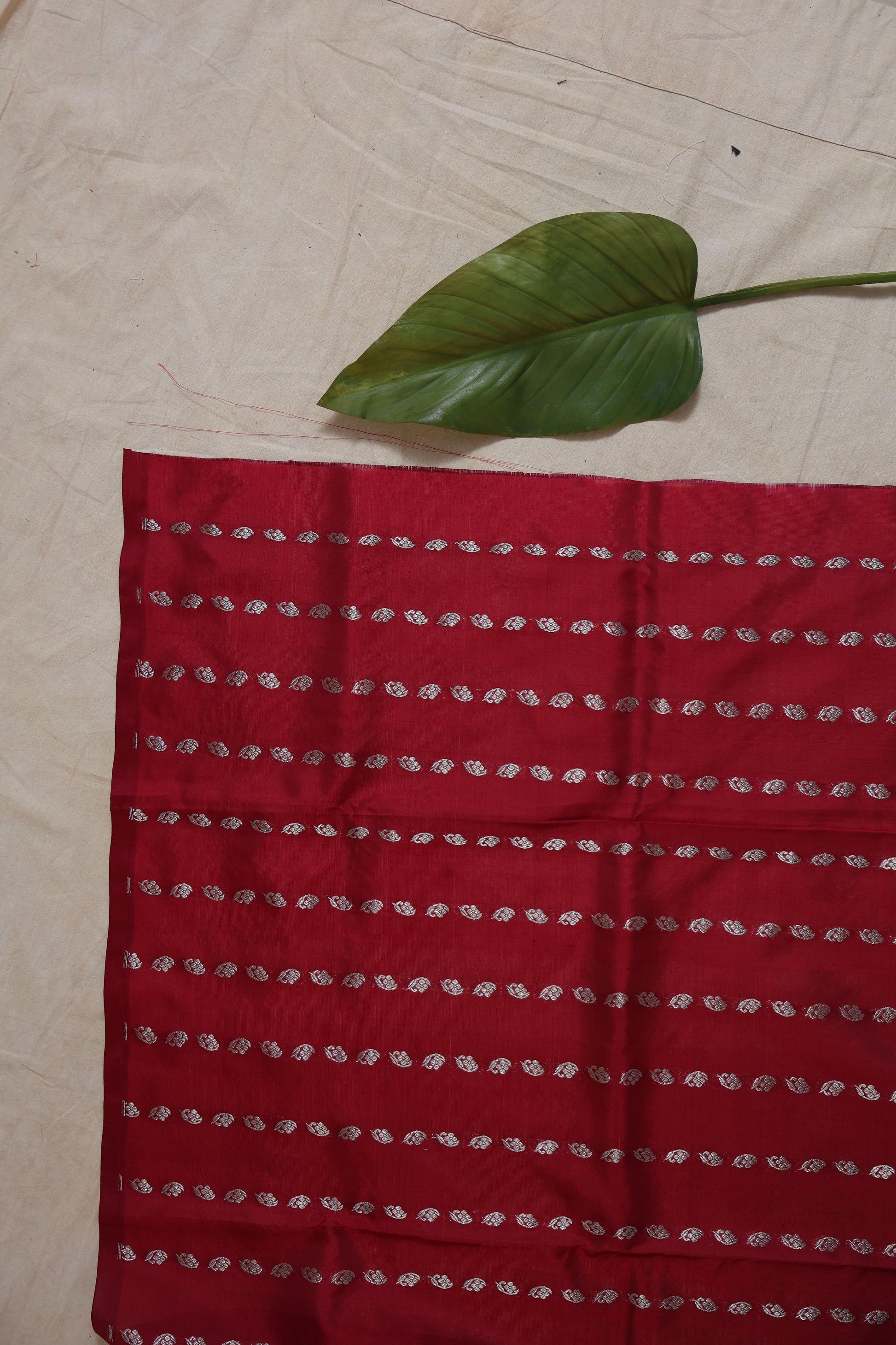 Full-length view of the crimson red Venkatgiri silk saree displaying its traditional craftsmanship and elegant finish.