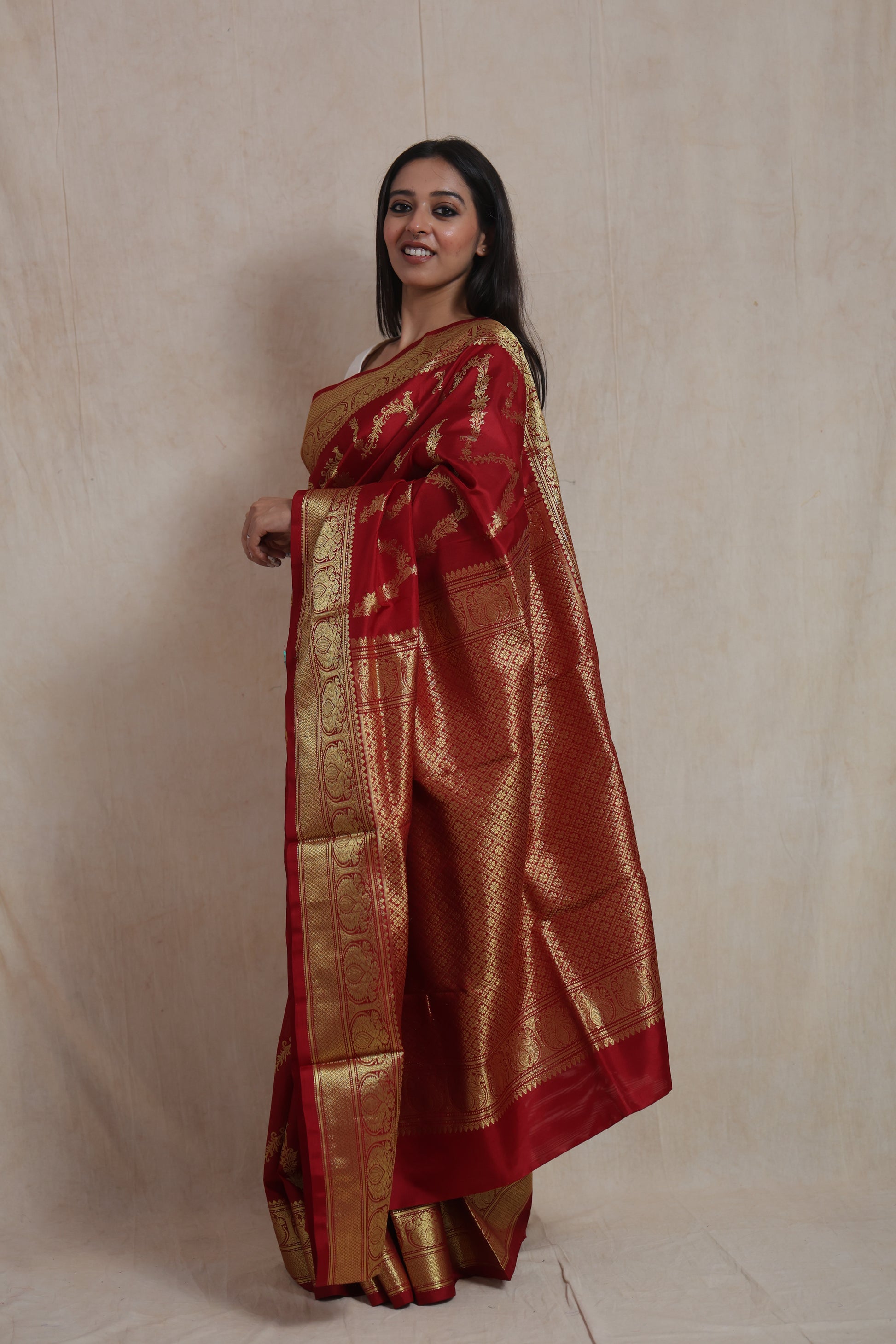 Side view of crimson Venkatgiri silk saree showcasing the richly woven pallu and elegant border