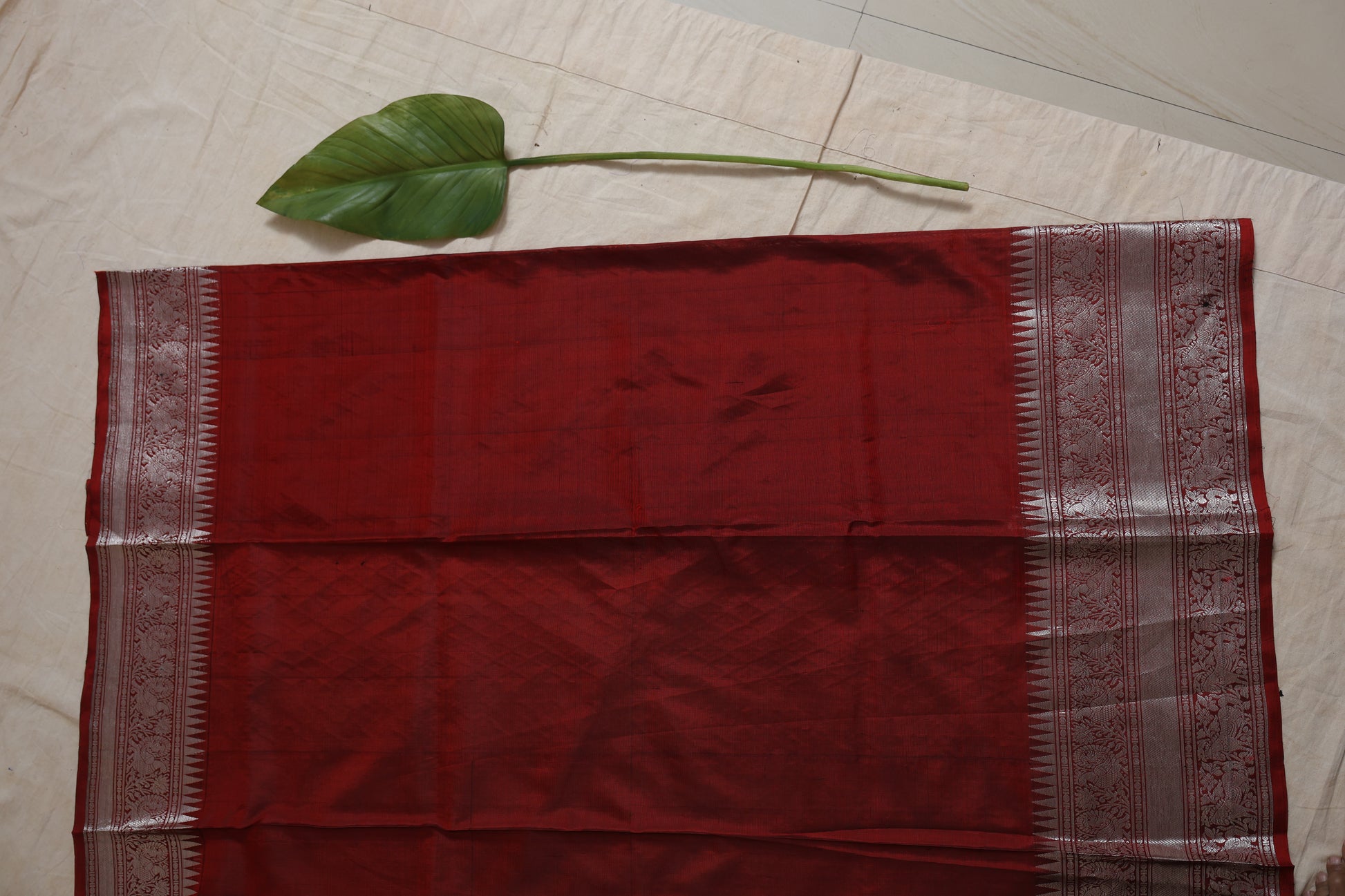 Full-length view of the black Kanjivaram silk saree featuring the rich woven border, pallu, and elegant craftsmanship.