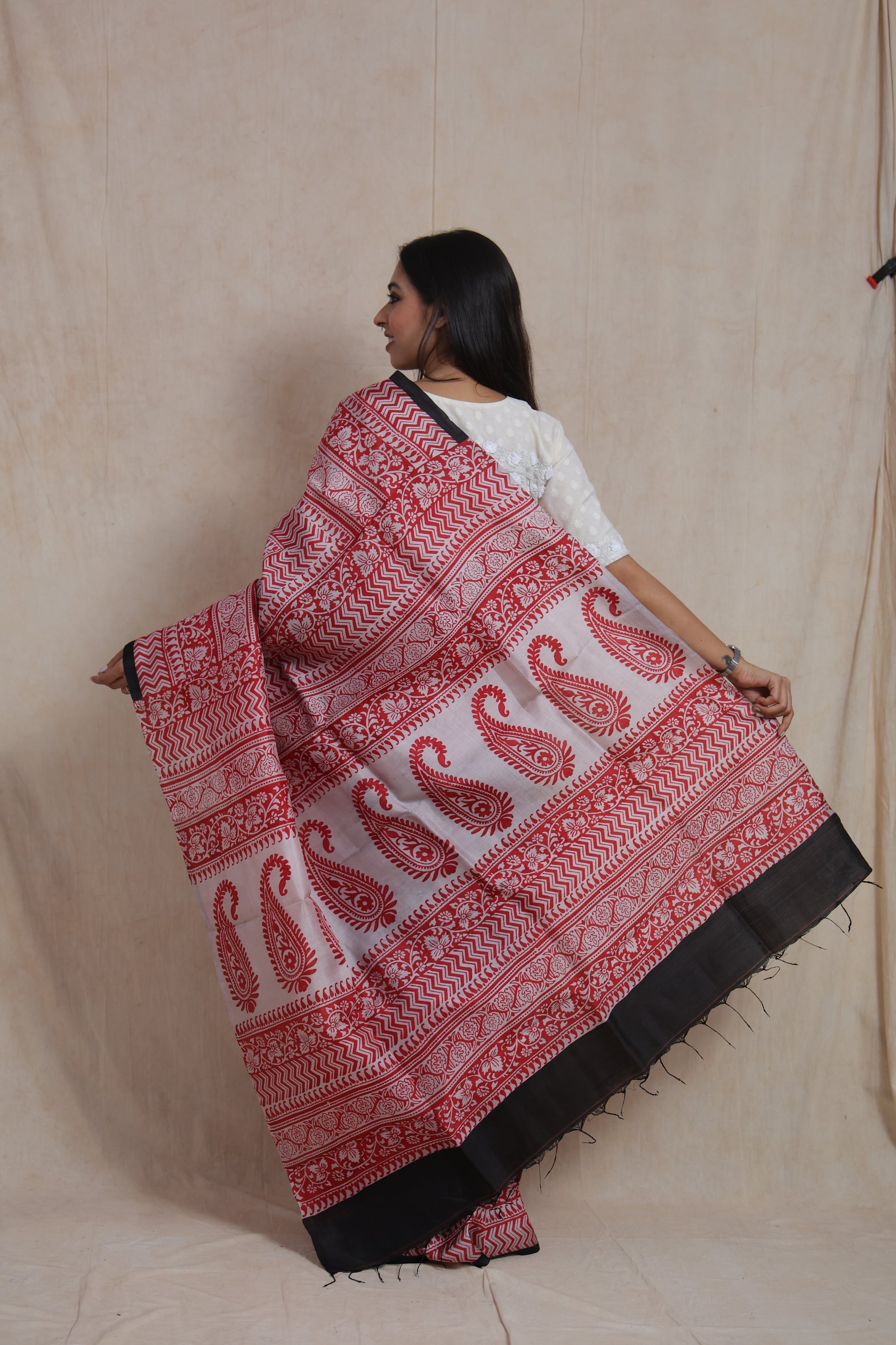 Back view showcasing detailed Batik printed pallu with paisley and floral patterns
