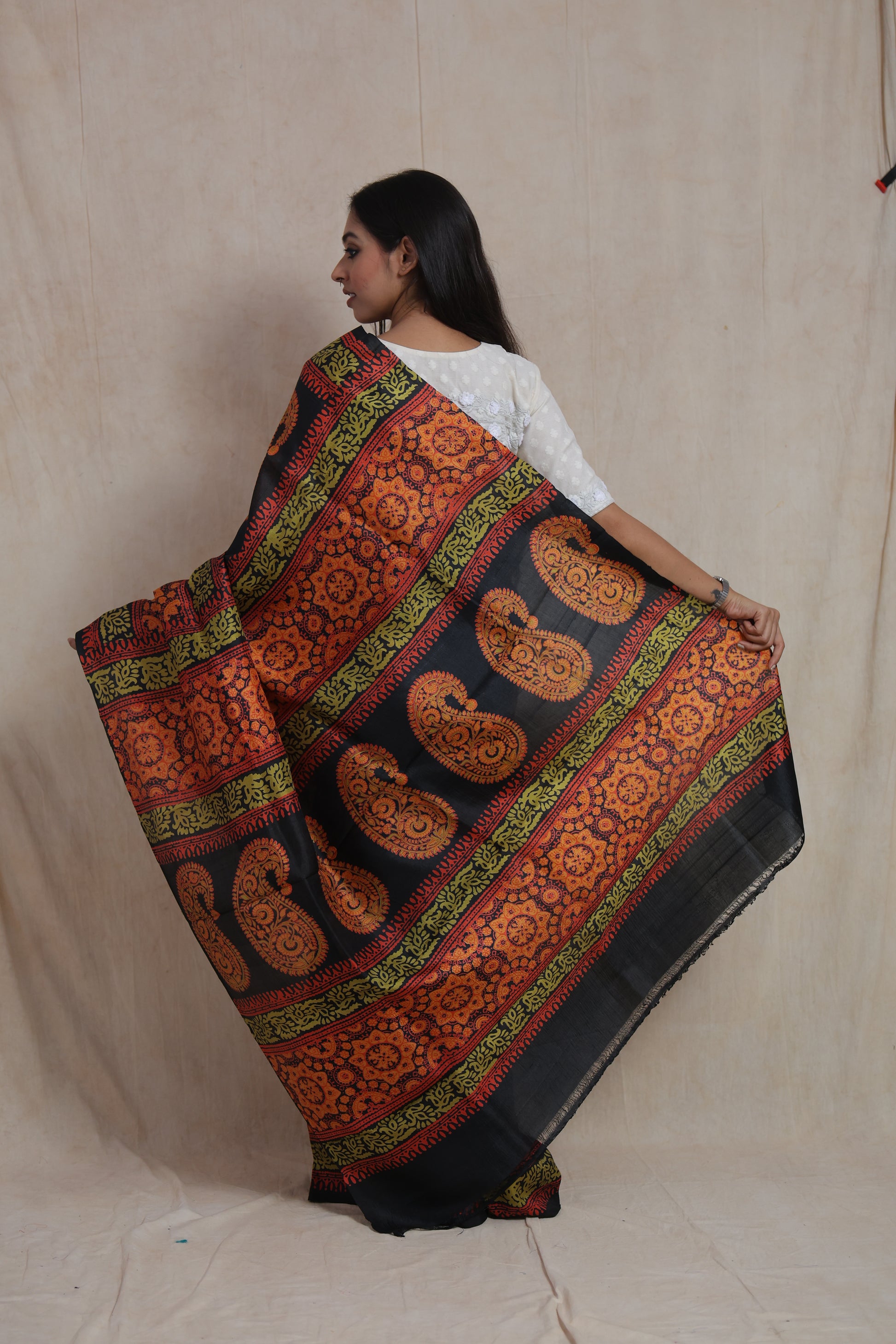Back view of Batik silk saree showcasing intricate paisley and floral motif pallu design