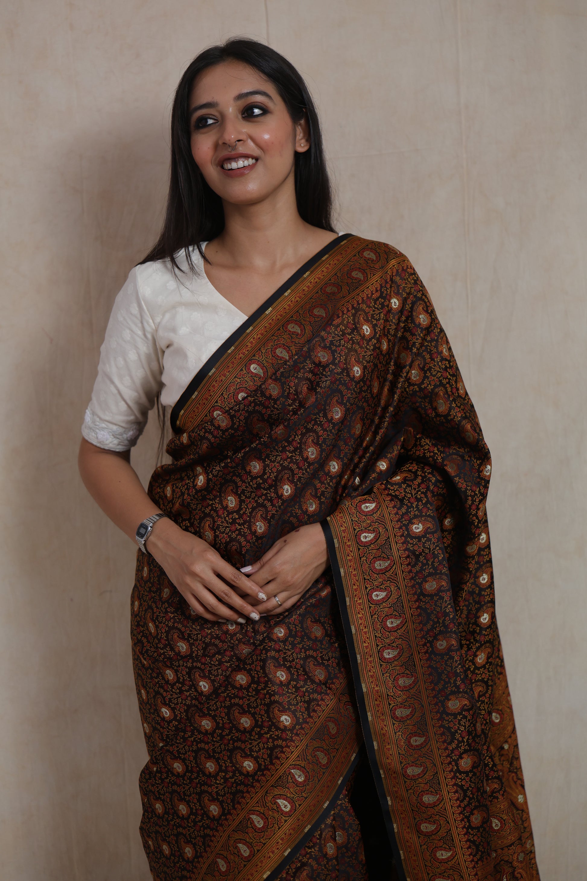 Close-up of Banarasi silk saree border featuring intricate paisley detailing