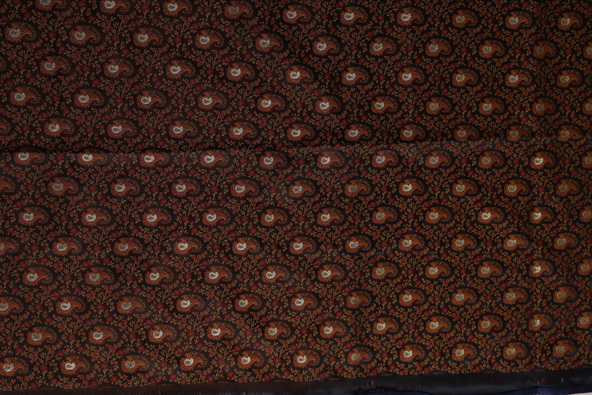 Detailed drape view of black Banarasi silk saree highlighting woven craftsmanship
