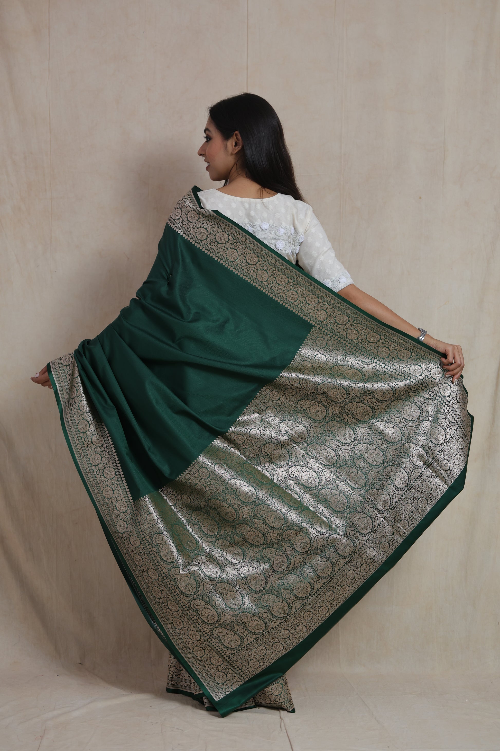 Back view of emerald green Banarasi art silk saree with richly woven pallu