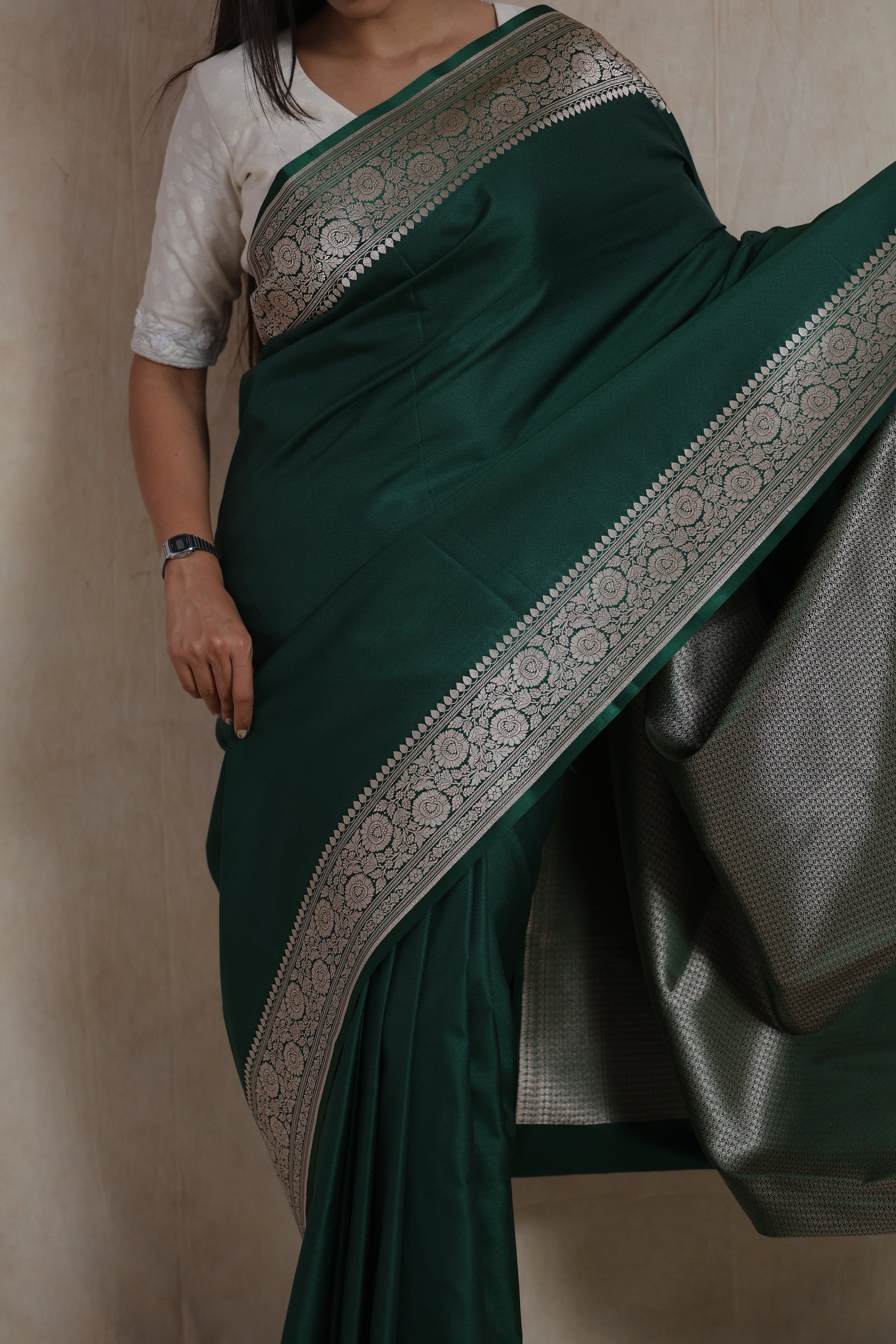 Portrait of model in emerald green Banarasi art silk saree
