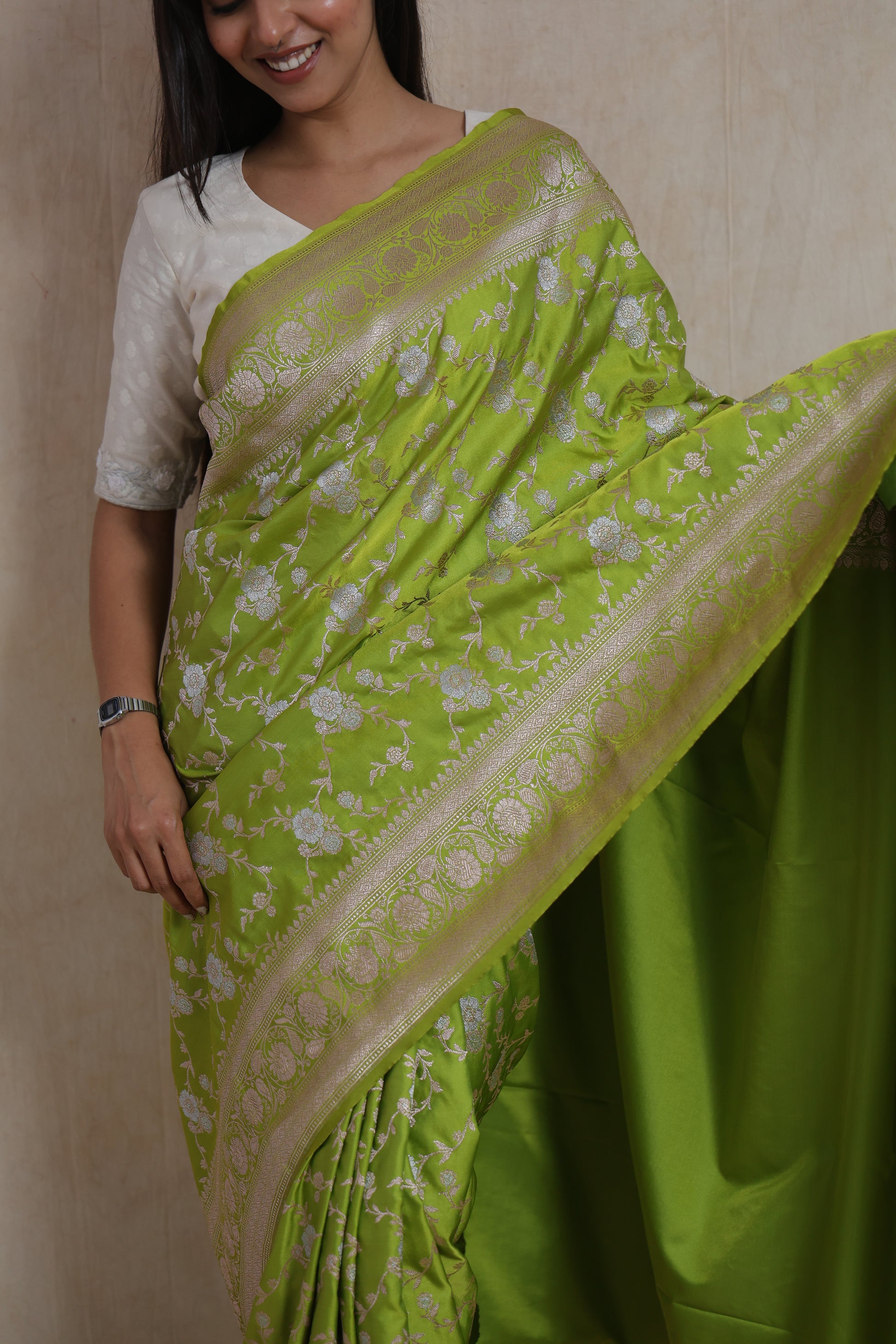 Portrait view of lime green Banarasi art silk saree with elegant floral woven patterns